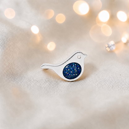 Keepsake memorial silver Robin  ashes charm, in sapphire glow, handcrafted in Lancashire, UK