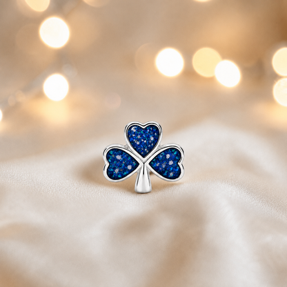 Sapphire glow sterling silver shamrock ashes memorial charm, handcrafted in Lancashire by keepsake memorial
