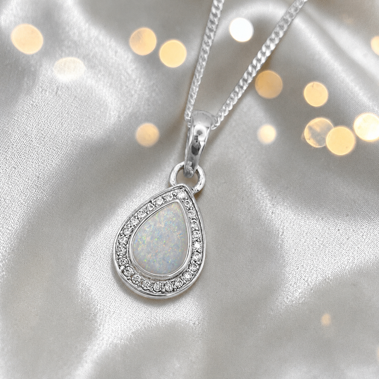 Seraph glow pear shaped ashes pendant with CZ in white snow, handcrafted in Lancashire UK