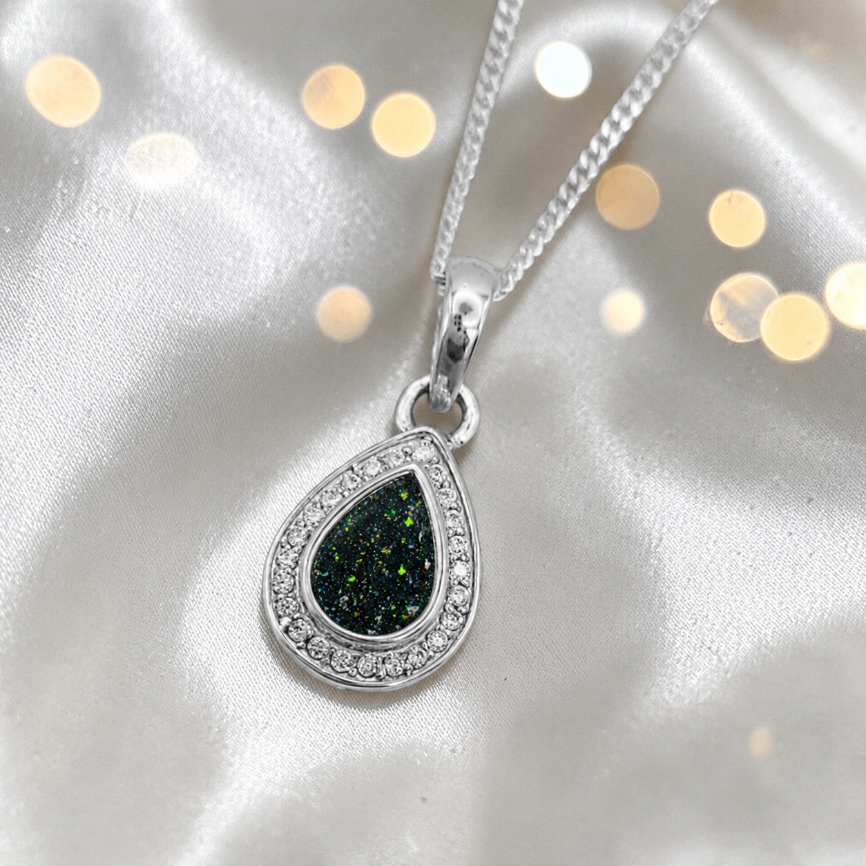 seraph glow pear shaped ashes pendant with CZ in black flame, handcrafted in Lancashire UK