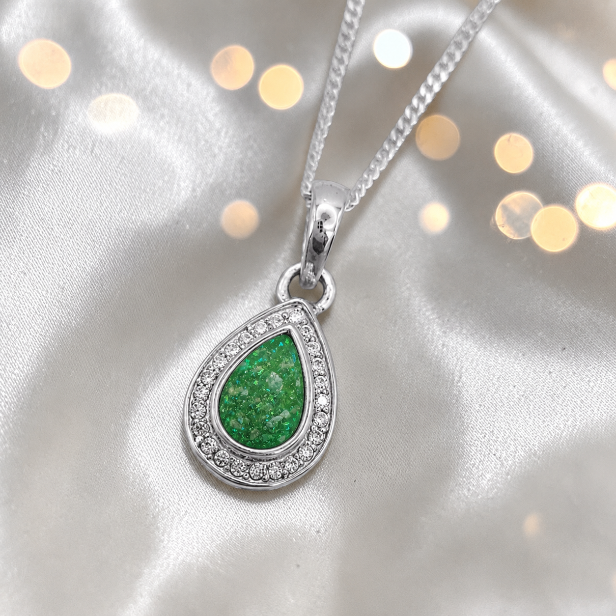 seraph glow pear shaped ashes pendant with CZ in fruit green, handcrafted in Lancashire UK