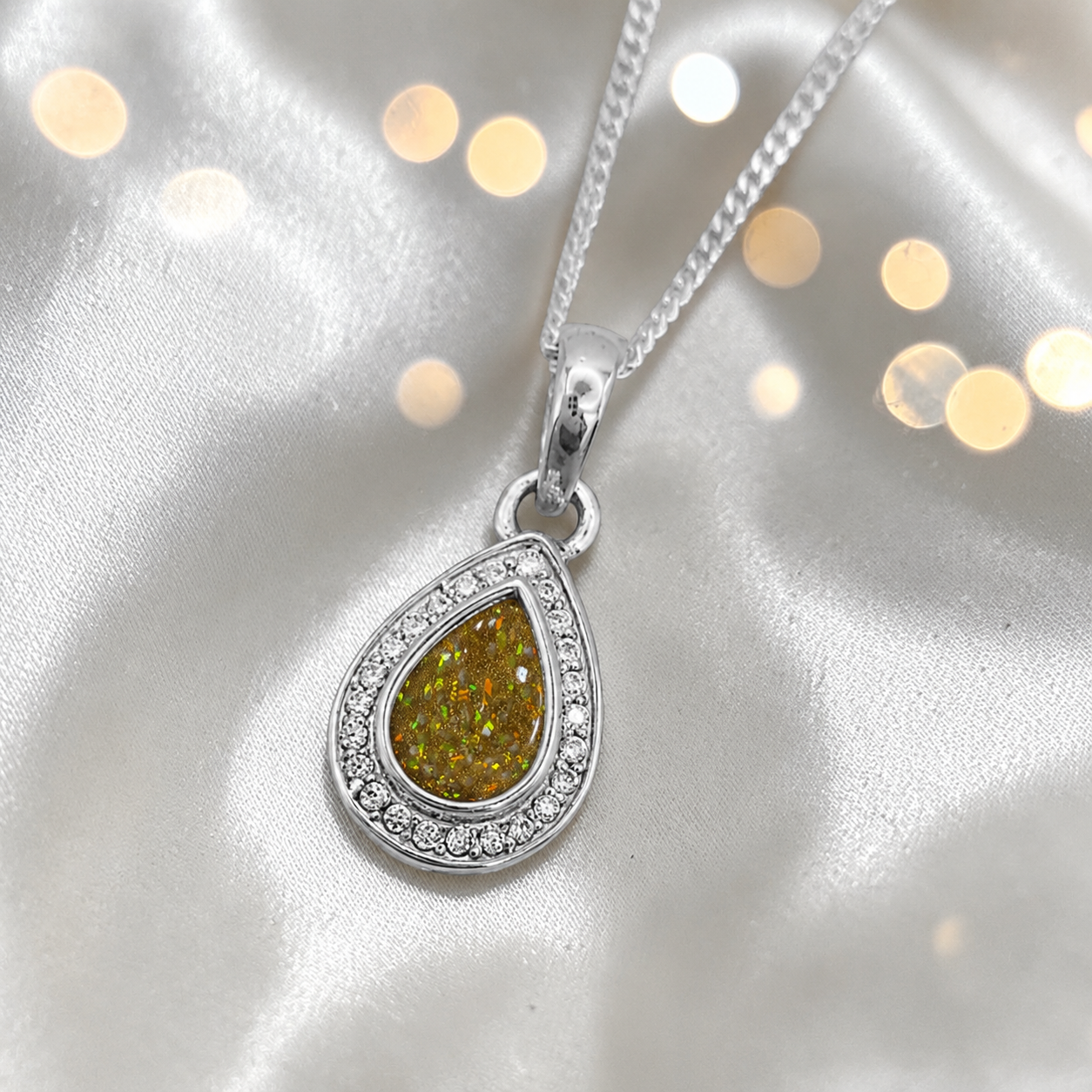 seraph glow pear shaped ashes pendant with CZ in gold olive, handcrafted in Lancashire UK