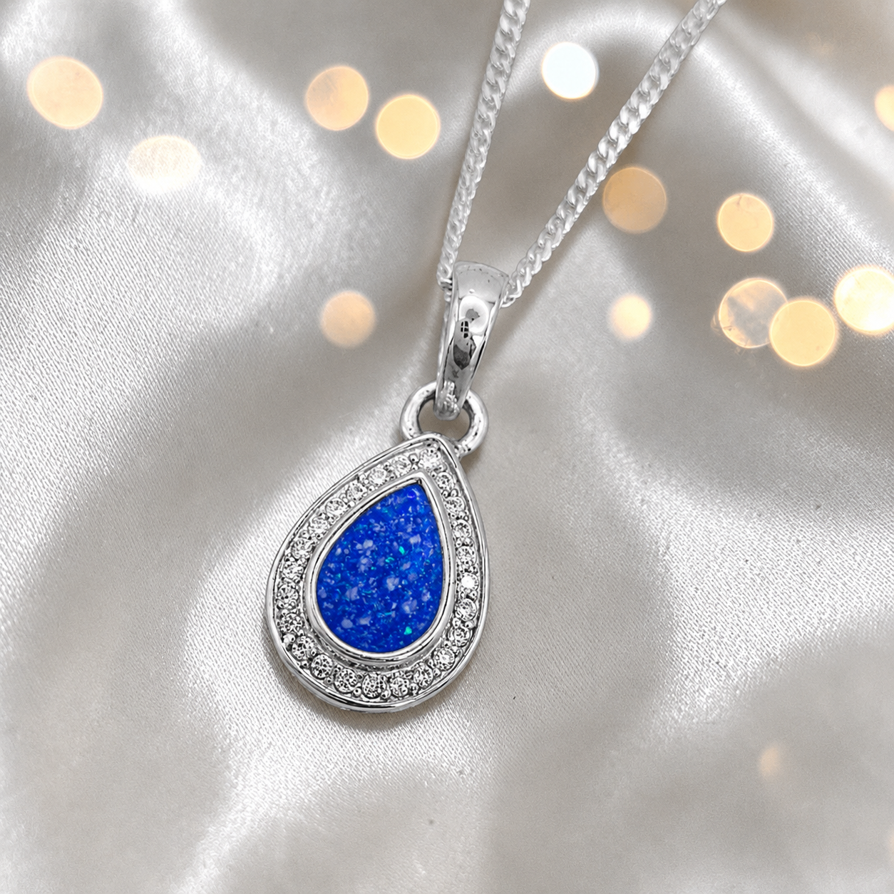 seraph glow pear shaped ashes pendant with CZ in royal blue, handcrafted in Lancashire UK