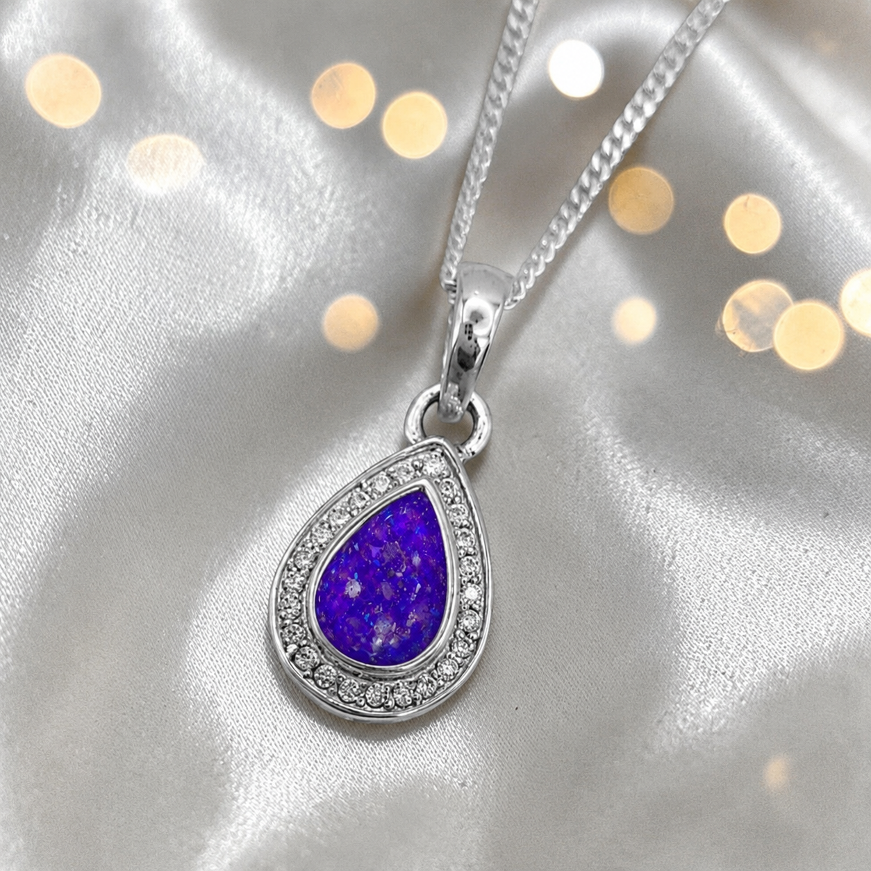 seraph glow pear shaped ashes pendant with CZ in sleepy lavender, handcrafted in Lancashire UK