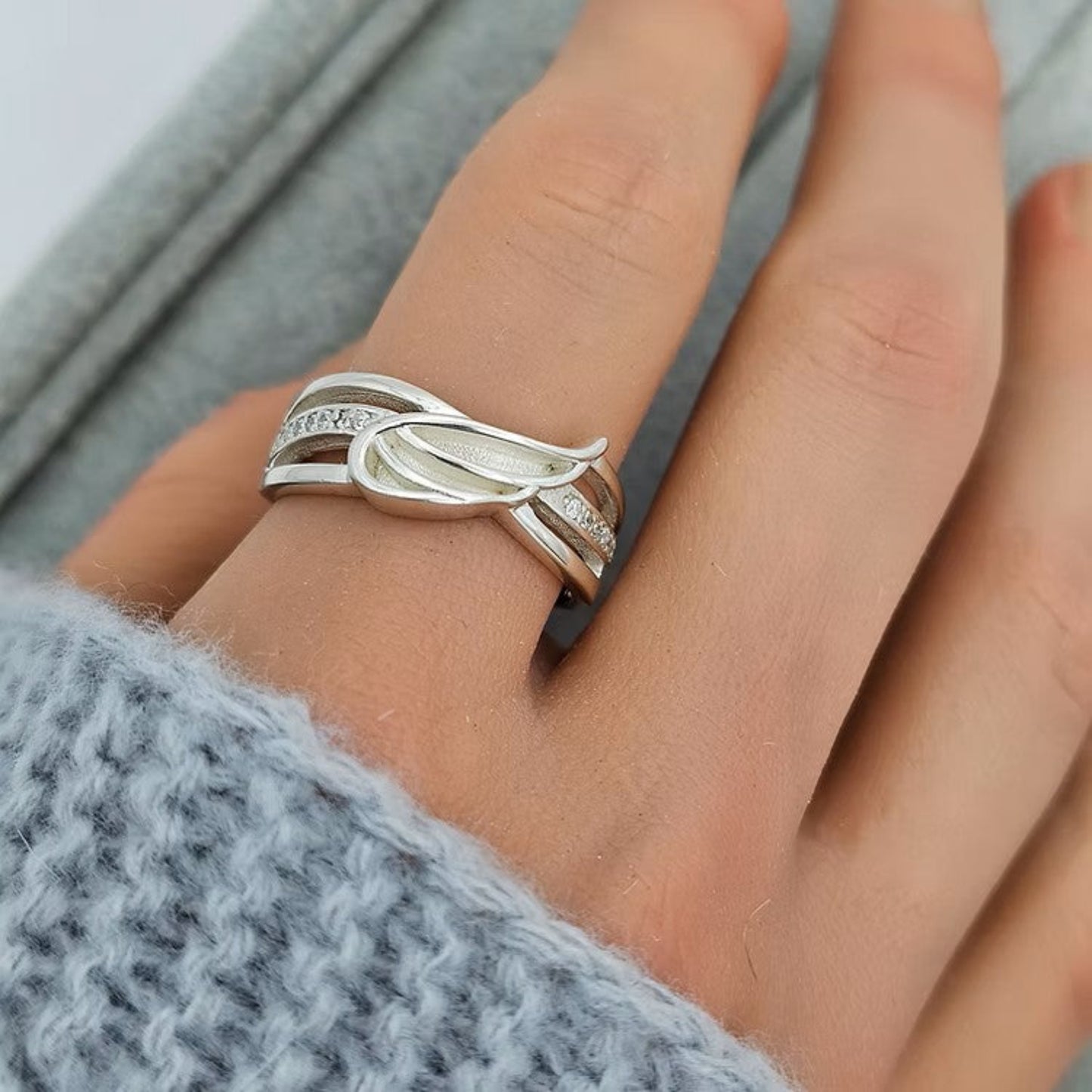 Angelica Ring worn on hand — silver angel wing ashes memorial ring, handcrafted in Lancashire, UK