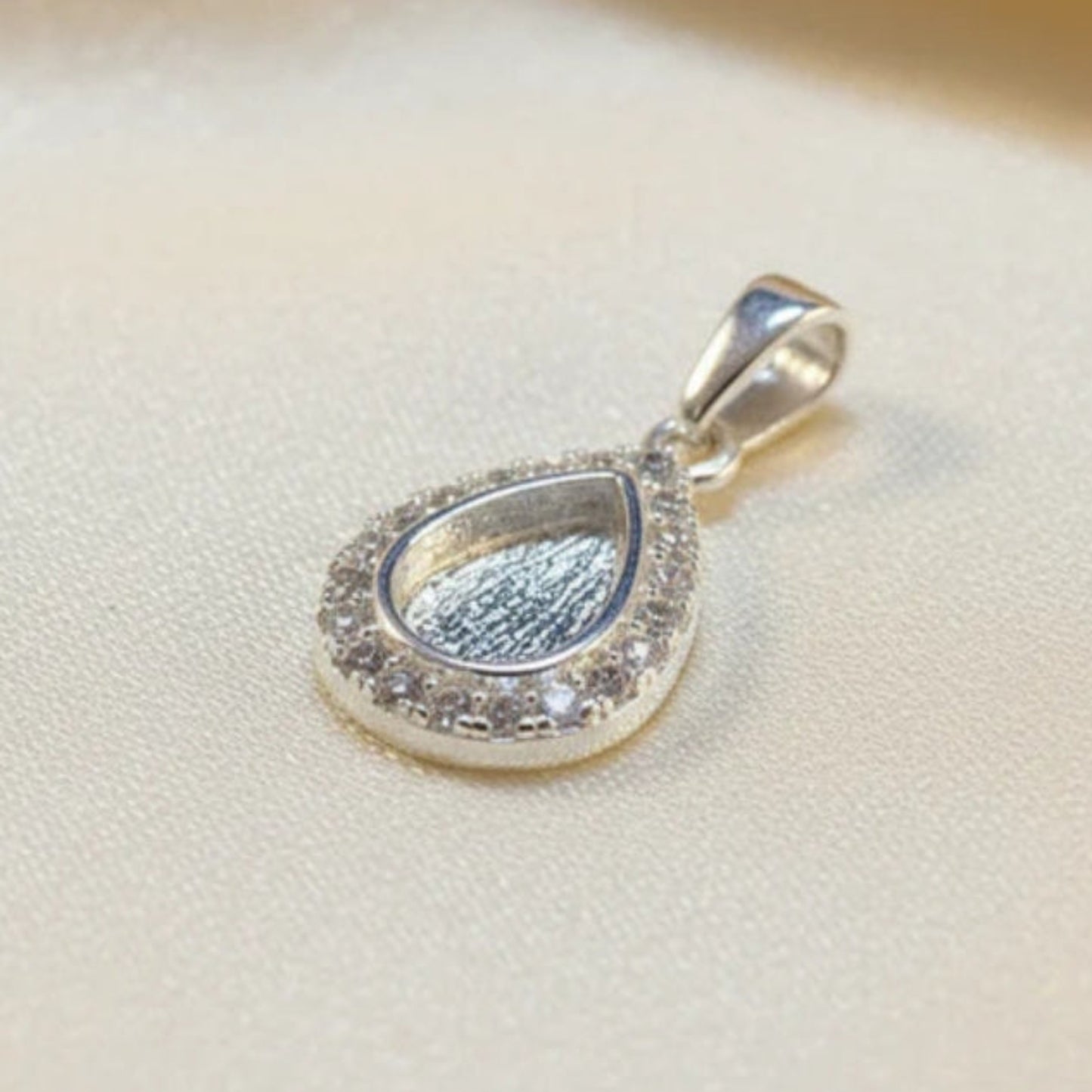 silver cz teardrop keepsake pendant, handcrafted in lancashire
