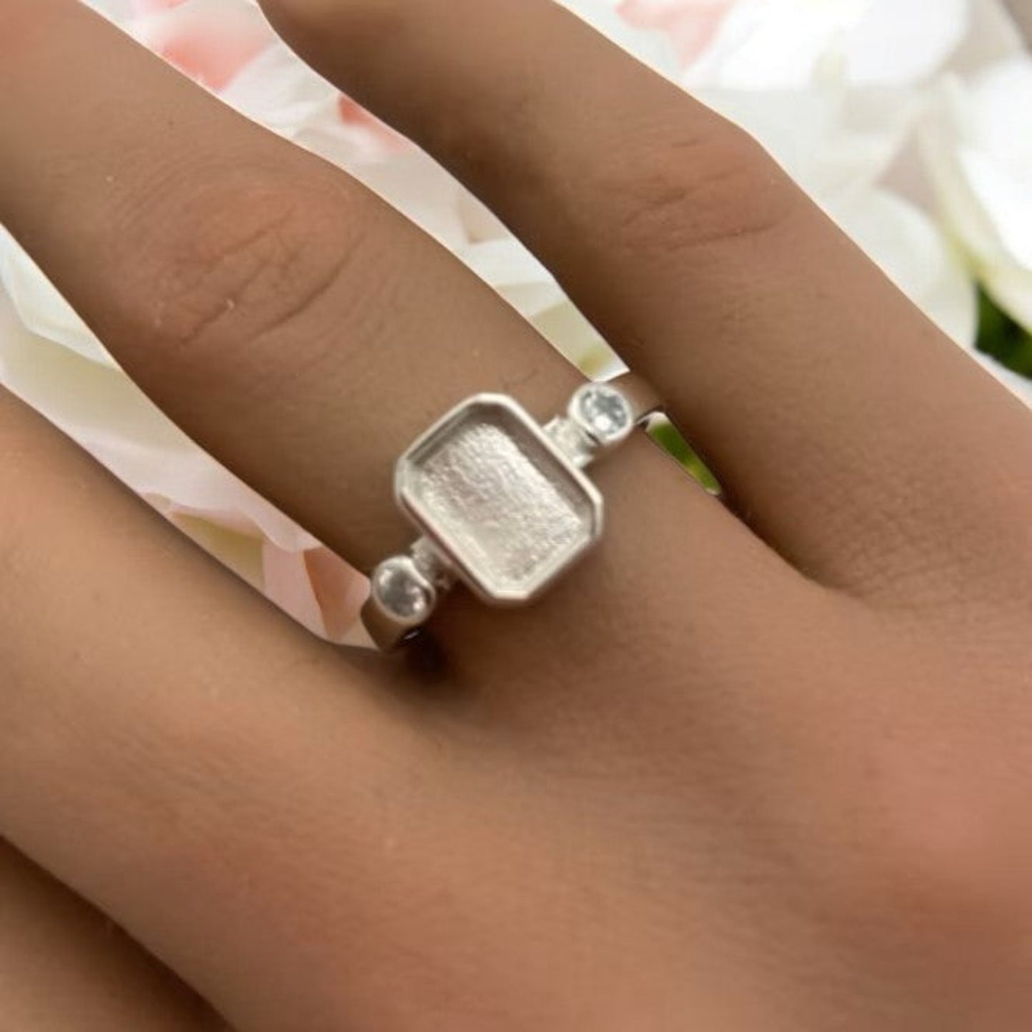 Anastasia Ring worn on hand — silver emerald cut ashes memorial ring, handcrafted in the UK