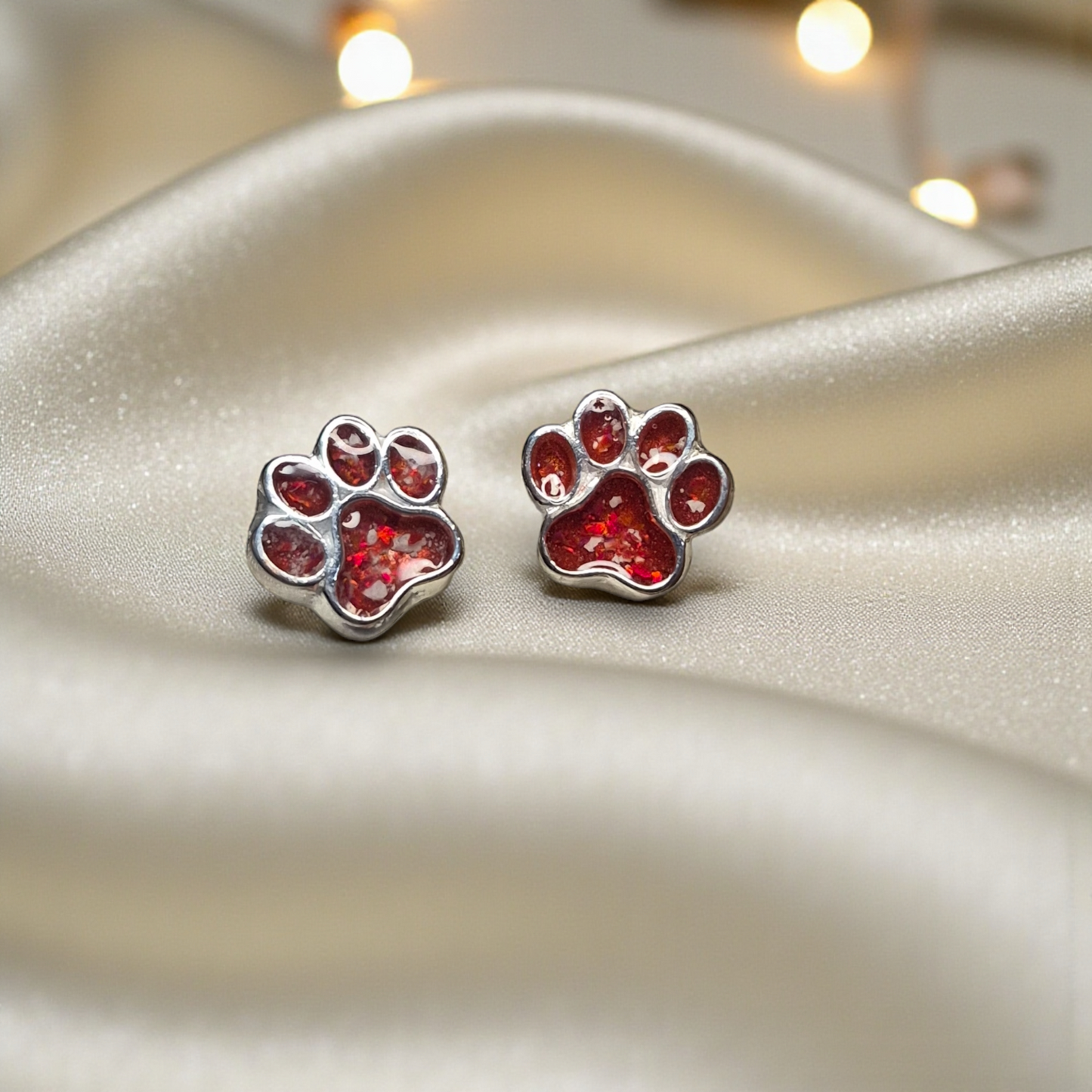 Cleo pet paw memorial ear studs — sterling silver ashes stud earrings, handcrafted in Lancashire, UK