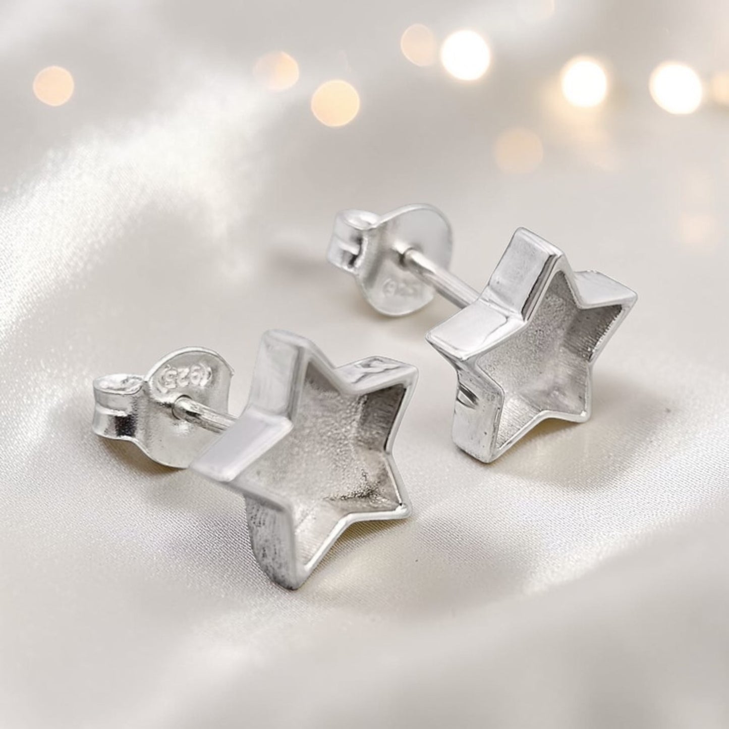 Starlight memorial stud earrings — sterling silver star ashes earrings, handcrafted in Lancashire, UK
