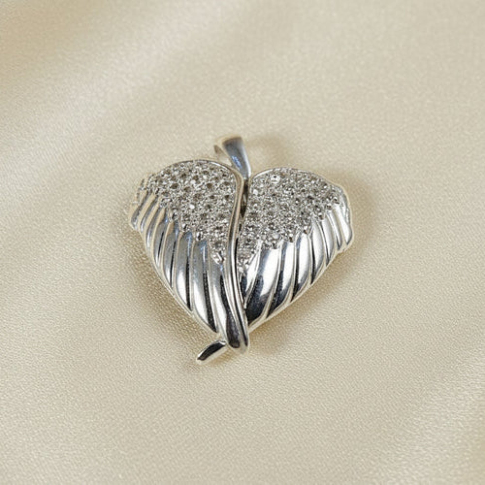 silver winged heart memorial locket, handcrafted in lancashire