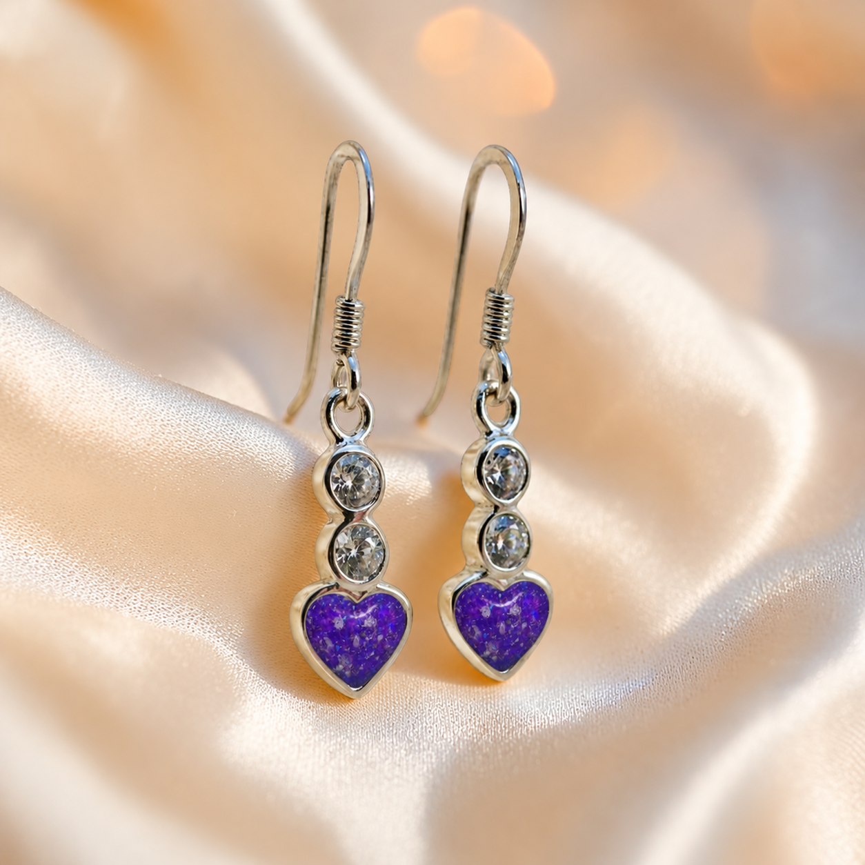 Pleione Earrings — silver heart drop ashes memorial earrings in Sleepy Lavender resin, handcrafted in Lancashire, UK