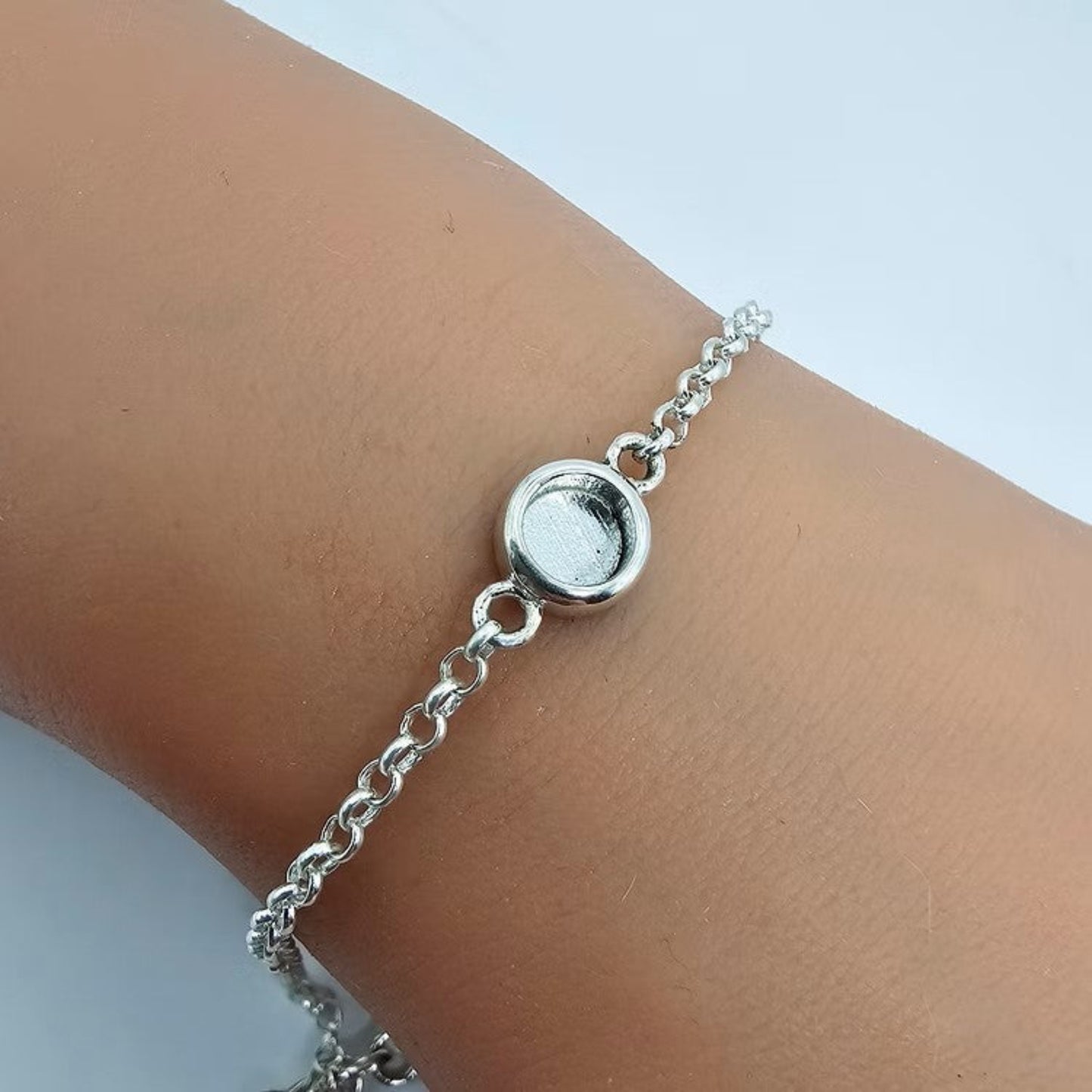 Celestia Bracelet — silver round belcher ashes memorial bracelet worn on wrist, handcrafted in Lancashire, UK