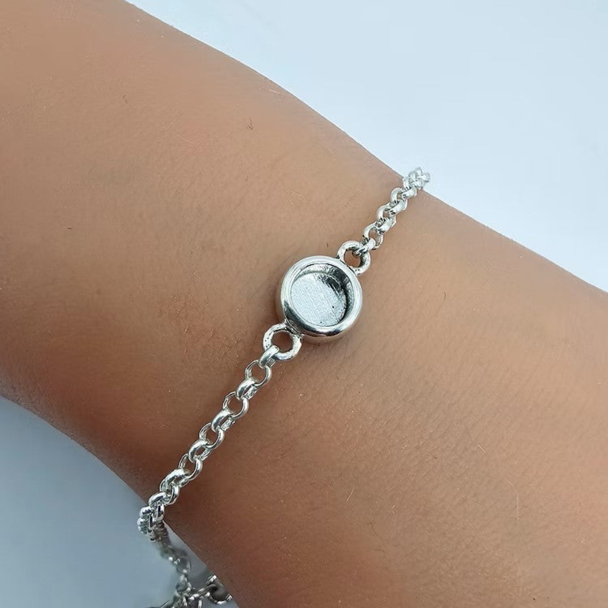 Celestia Bracelet — silver round belcher ashes memorial bracelet worn on wrist, handcrafted in Lancashire, UK