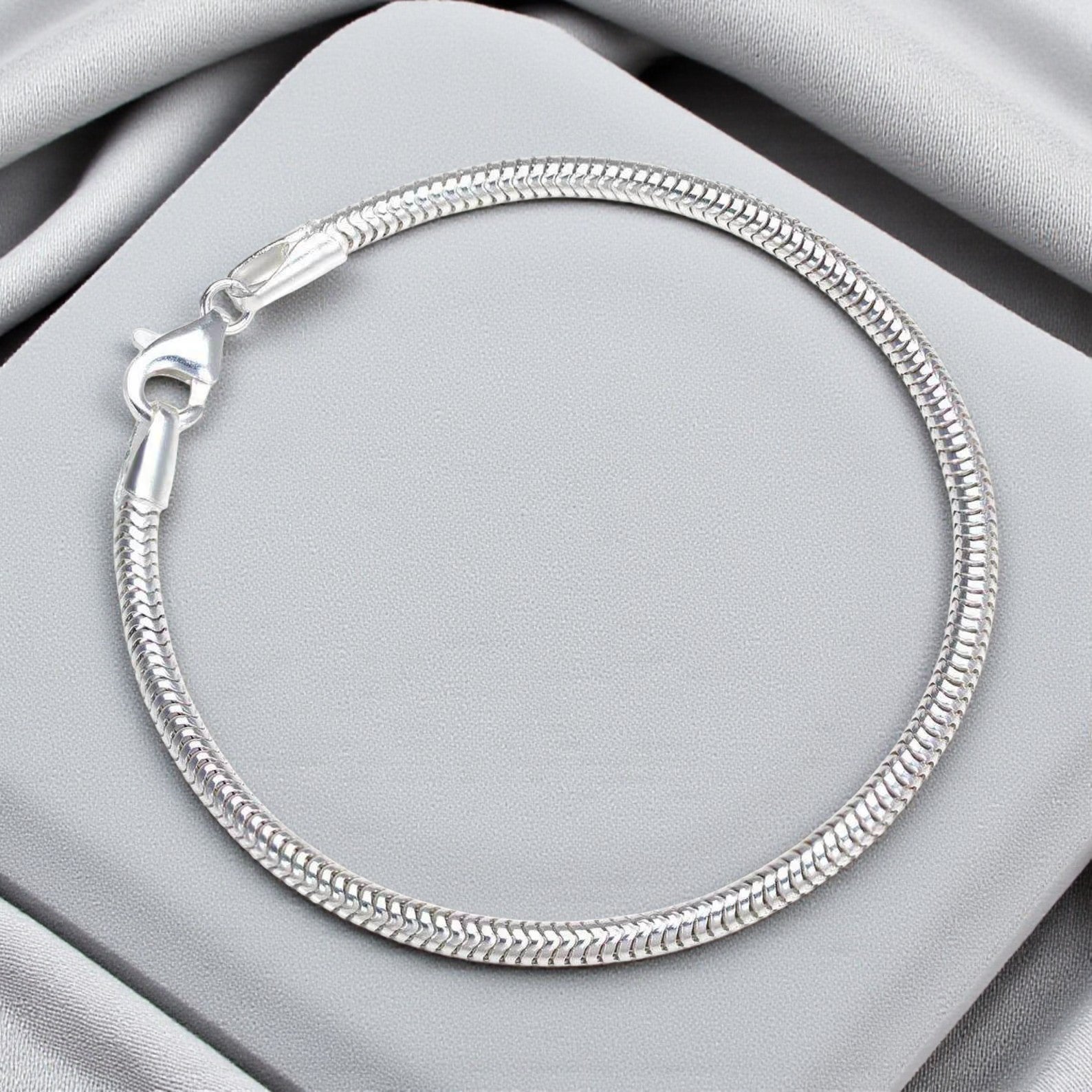 Silver snake charm bracelet, handcrafted in Lancashire, UK