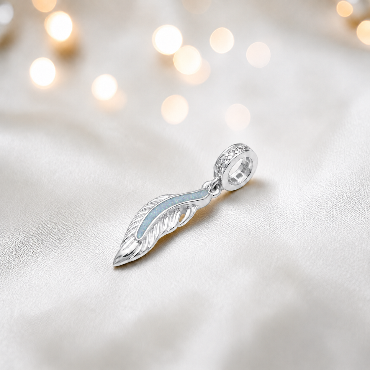 White snow sterling silver heavens feather  ashes memorial dangle  charm, handcrafted in Lancashire by keepsake memorial