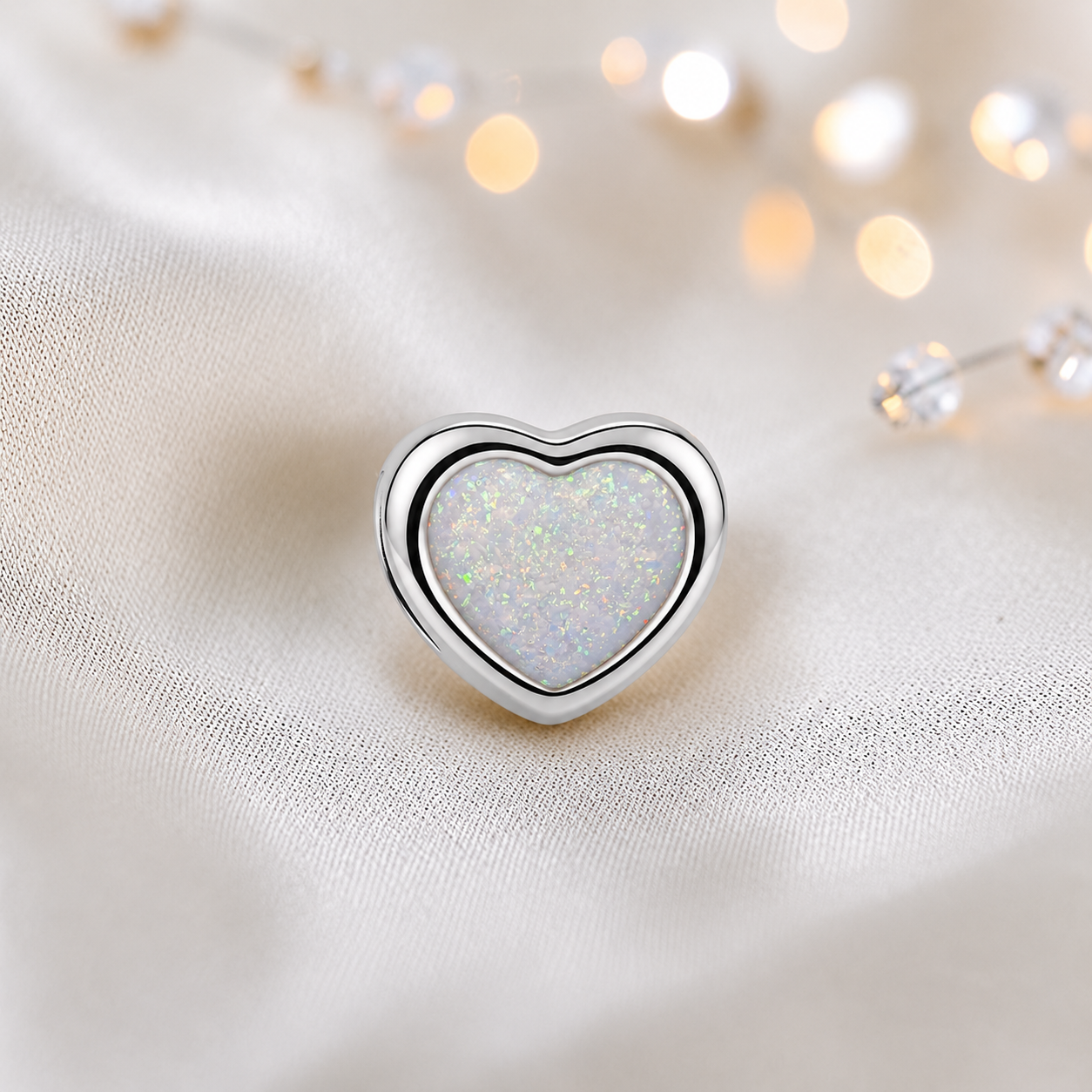 White snow sterling silver peaceful heart ashes memorial charm, handcrafted in Lancashire by keepsake memorial