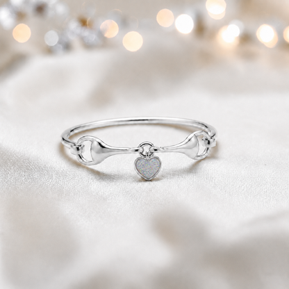 Silver Rocket snaffle bit ashes bangle in white snow,  handcrafted in Lancashire UK - by Keepsake Memorial Jewellery