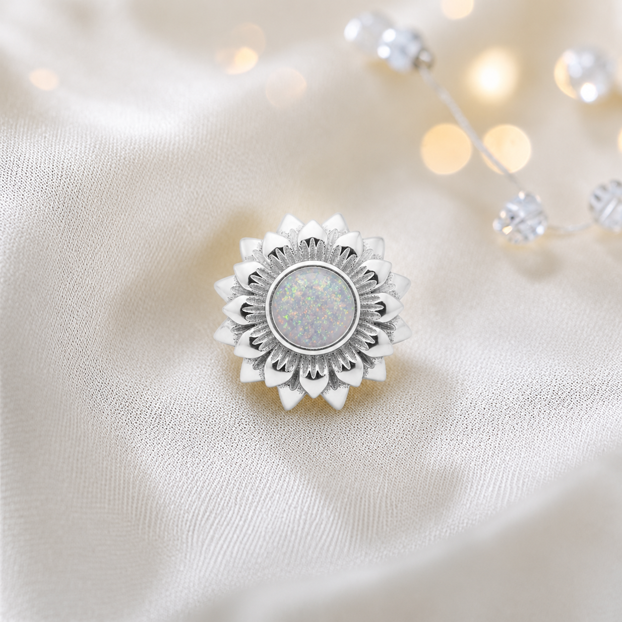 White snow sterling silver sunflower ashes memorial charm, handcrafted in Lancashire by keepsake memorial
