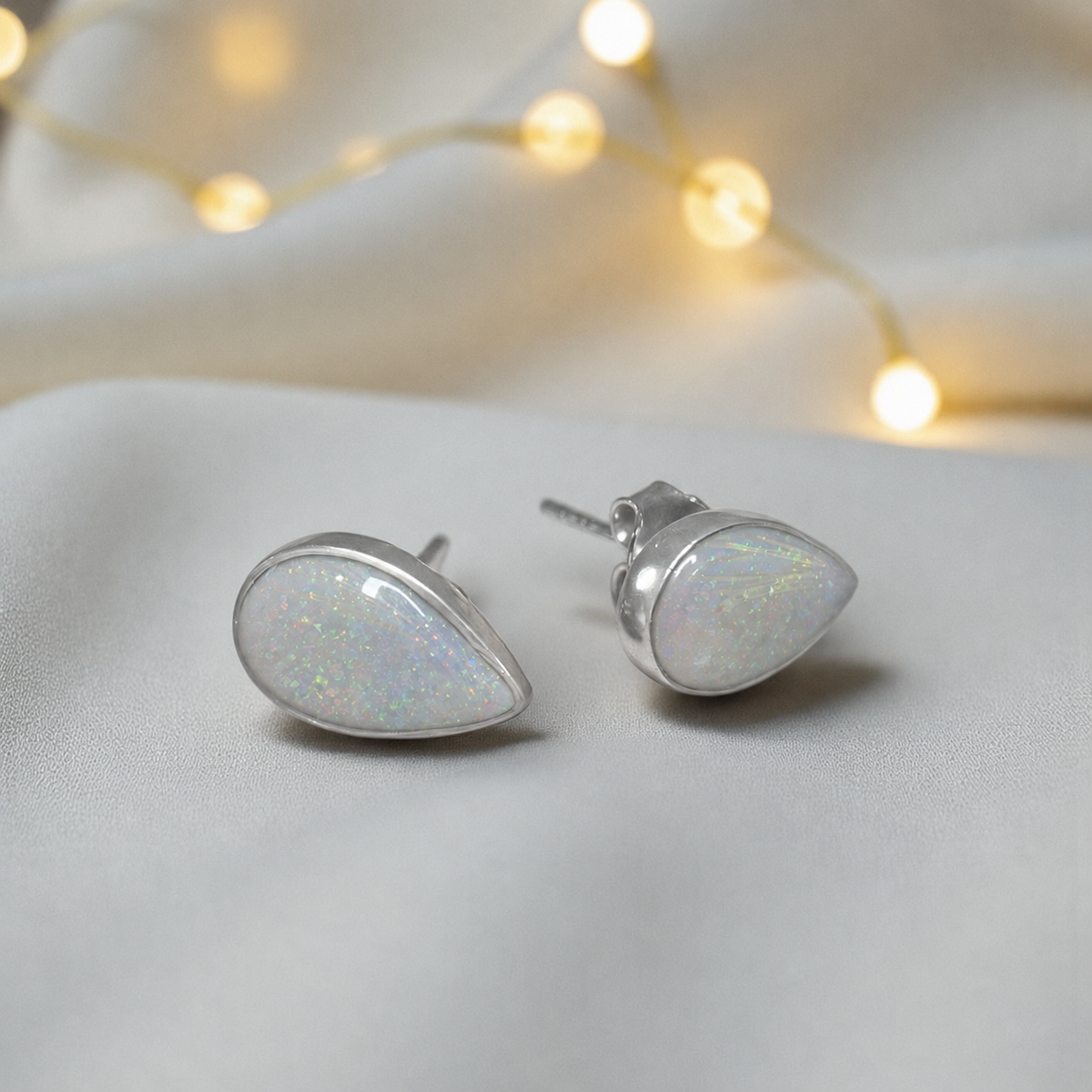 Pure Radiance memorial earrings in White Snow opal — sterling silver, handcrafted in Lancashire, UK