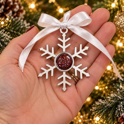 Stainless Steel Ruby red ashes snowflake ornament, handcrafted by Keepsake memorial jewellery in lancashire