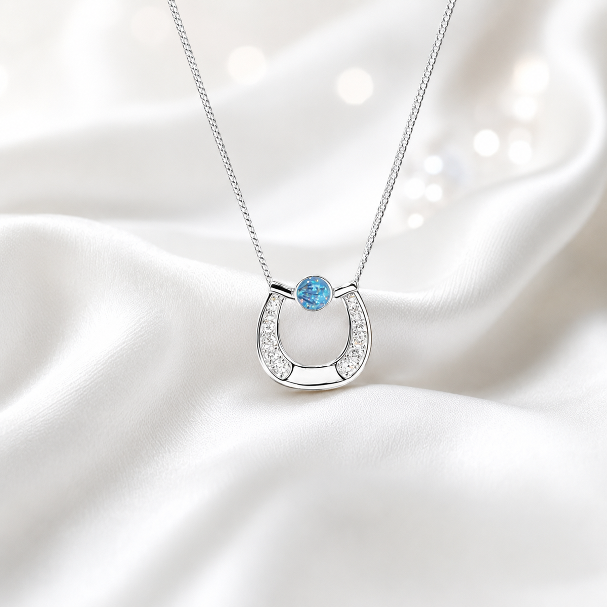 Sparkle horseshoe ashes pendant in white snow,  handcrafted in Lancashire UK - by Keepsake Memorial Jewellery