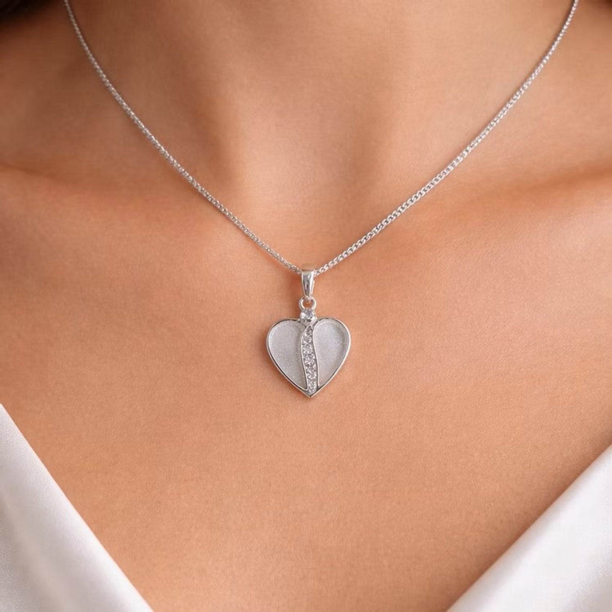 silver split cz heart memory pendant on neck, lancashire