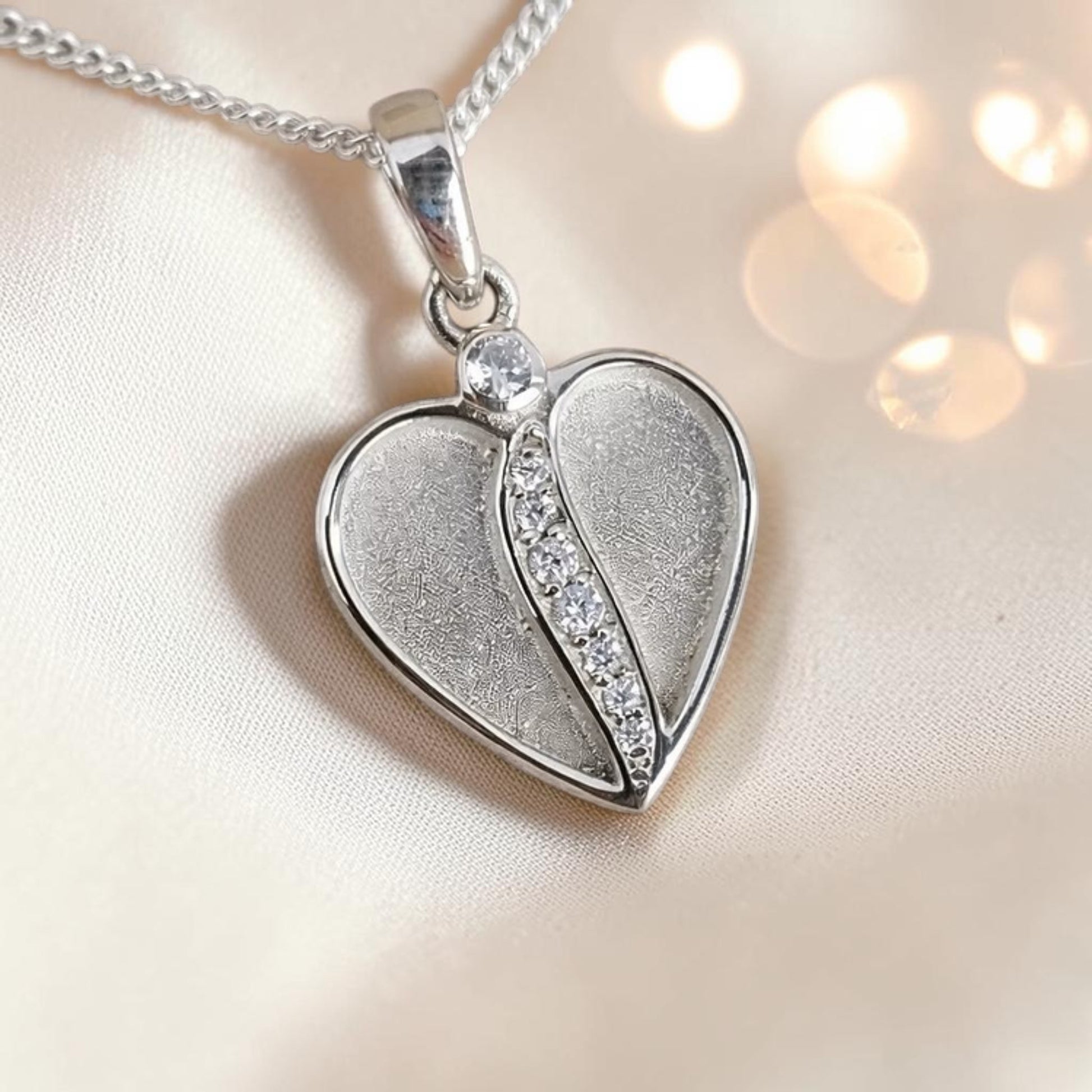 Split heart CZ ashes memorial pendant in sterling silver, handcrafted in the UK