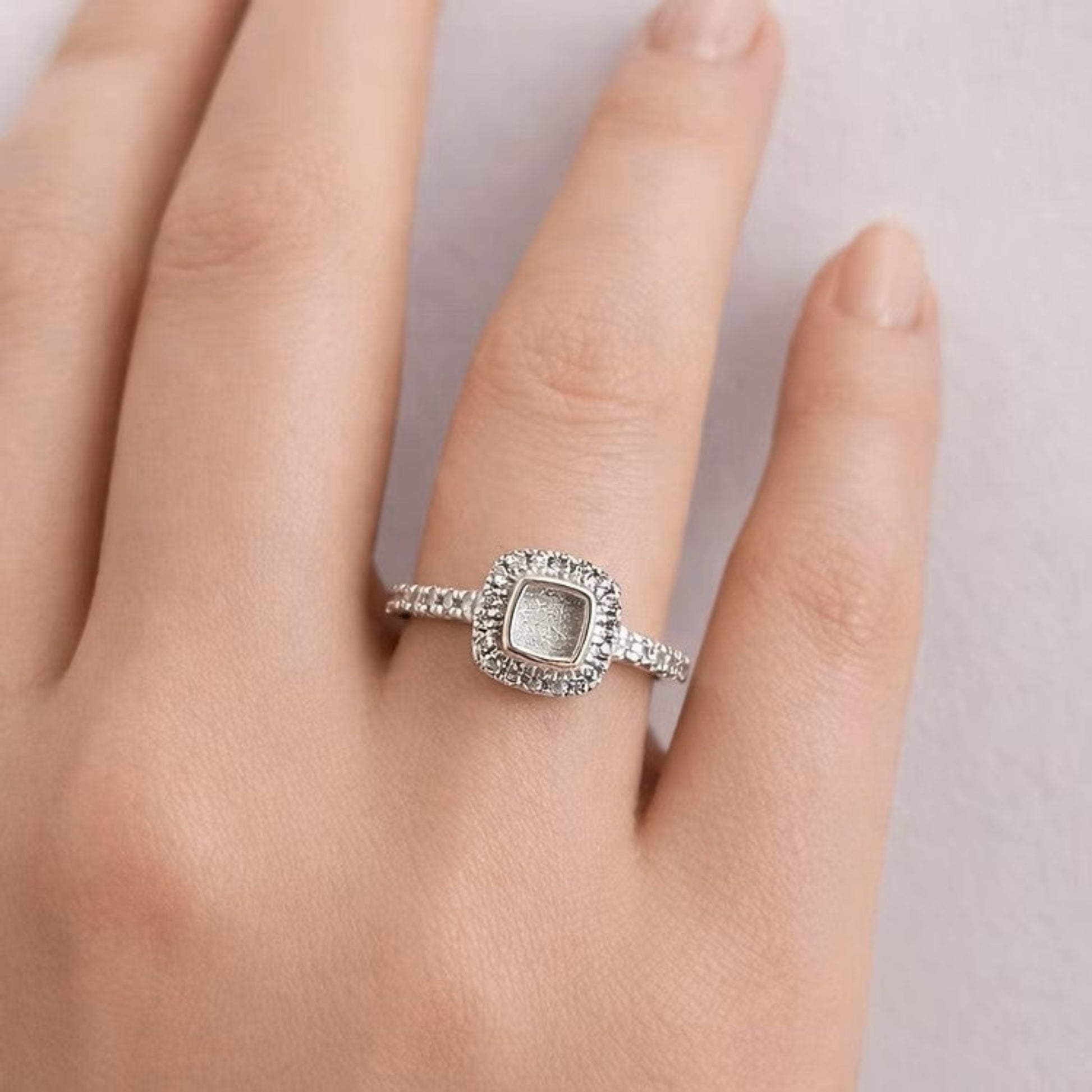 Florence Keepsake Ring worn on hand — silver square cushion ashes memorial ring, handcrafted in the UK