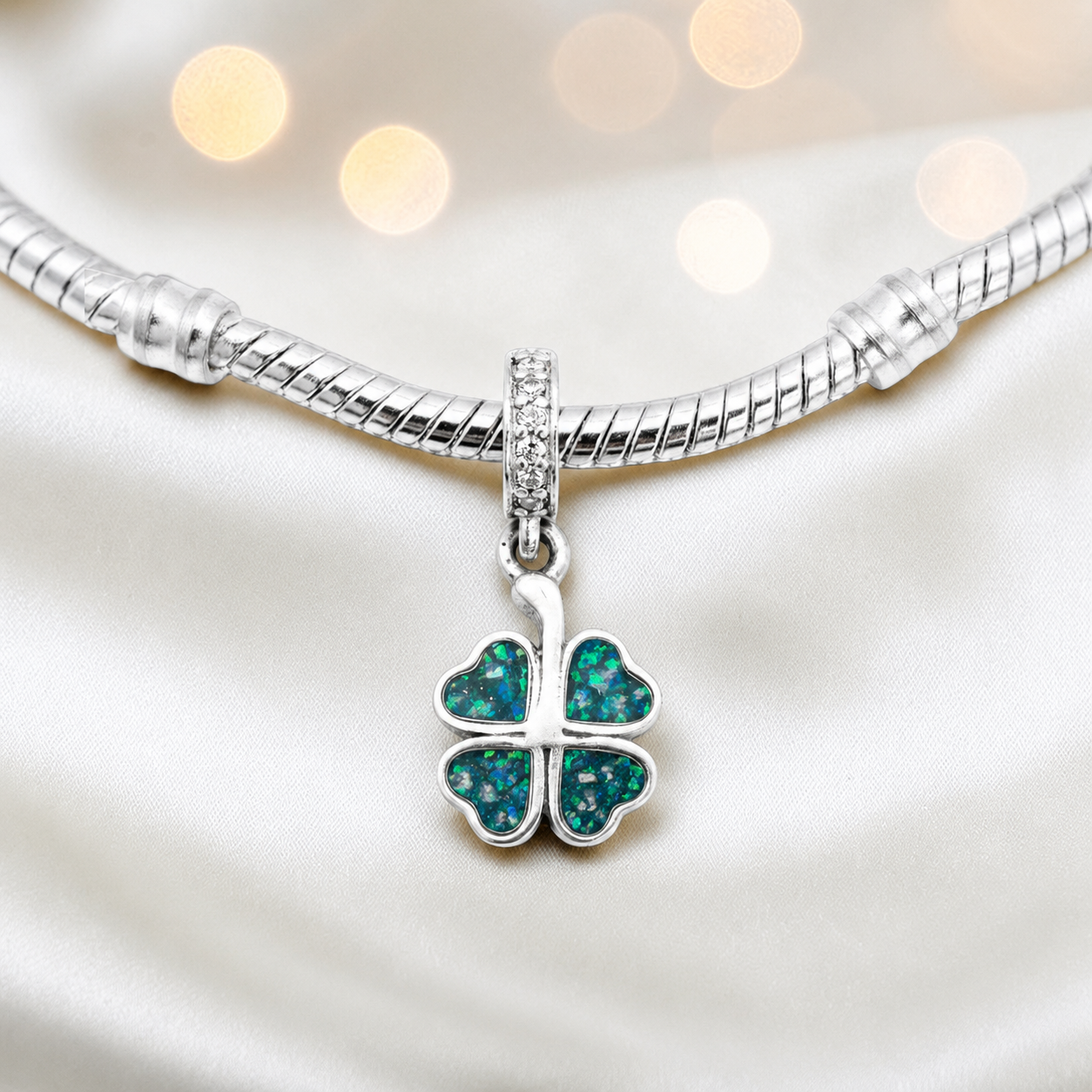 Teal mist sterling silver clover dangle ashes memorial charm, handcrafted in Lancashire by keepsake memorial