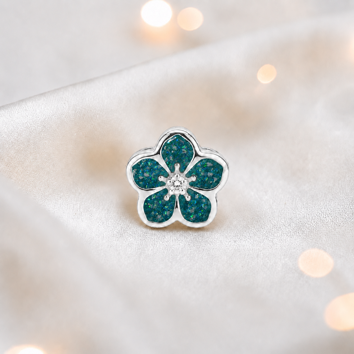 Teal mist sterling silver forget me not ashes memorial charm, handcrafted in Lancashire by keepsake memorial