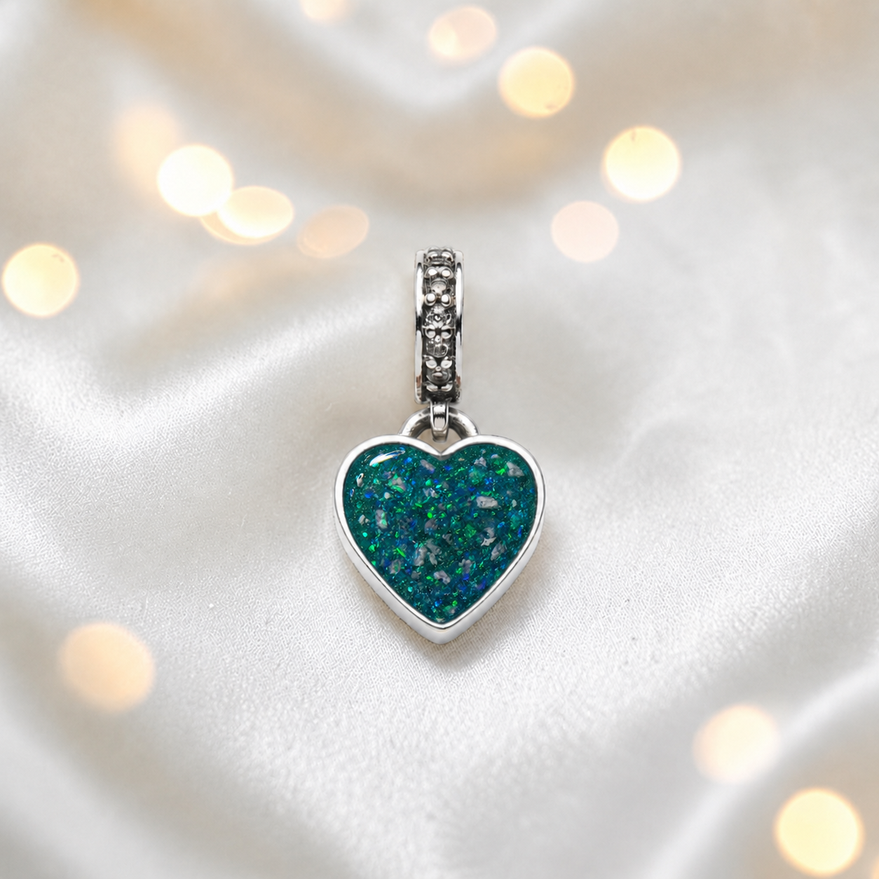Teal mist sterling silver heavens heart ashes memorial dangle  charm, handcrafted in Lancashire by keepsake memorial