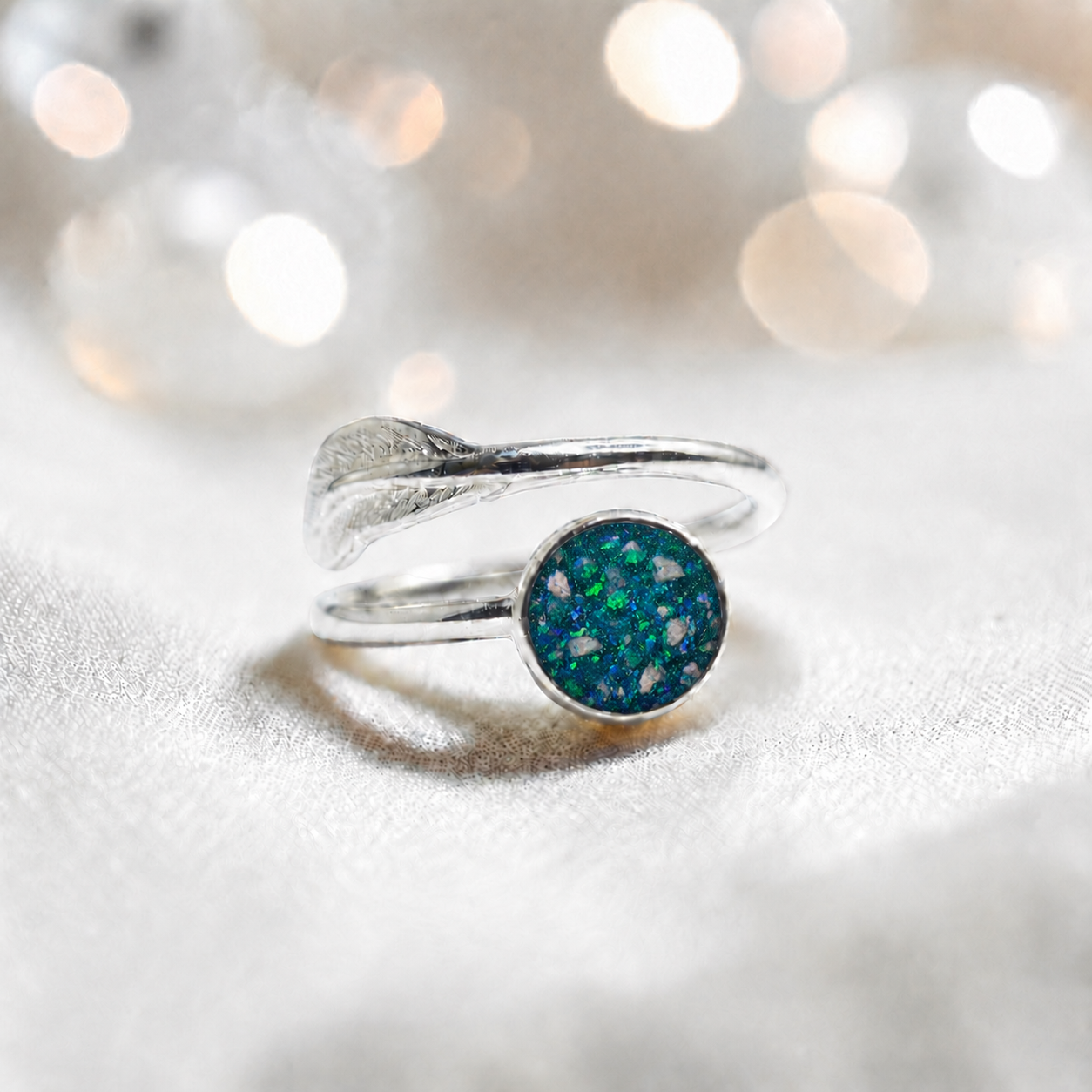 Feather Whisper Ring — silver feather ashes memorial ring, in teal mist, handcrafted in Lancashire, UK