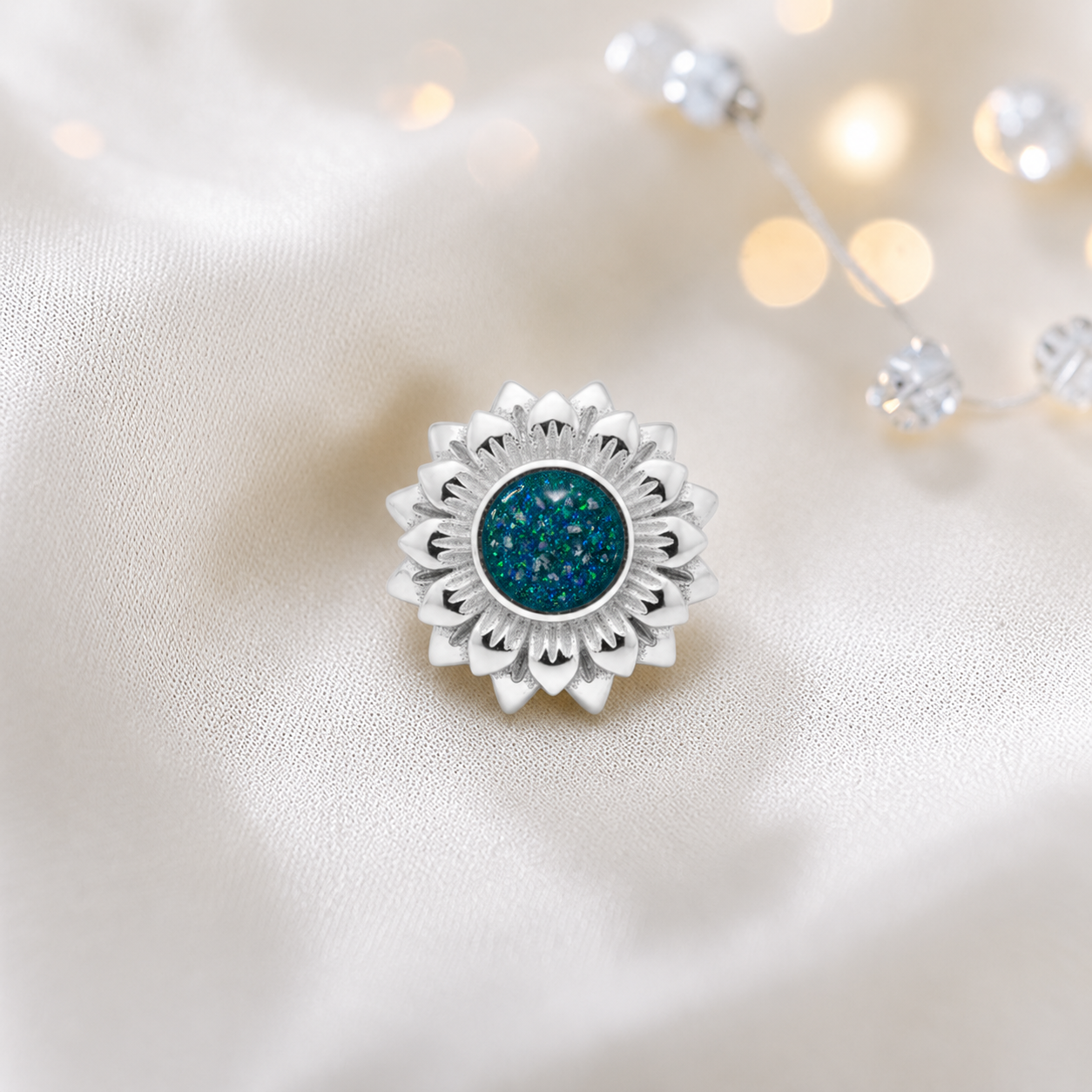 Teal mist sterling silver sunflower ashes memorial charm, handcrafted in Lancashire by keepsake memorial