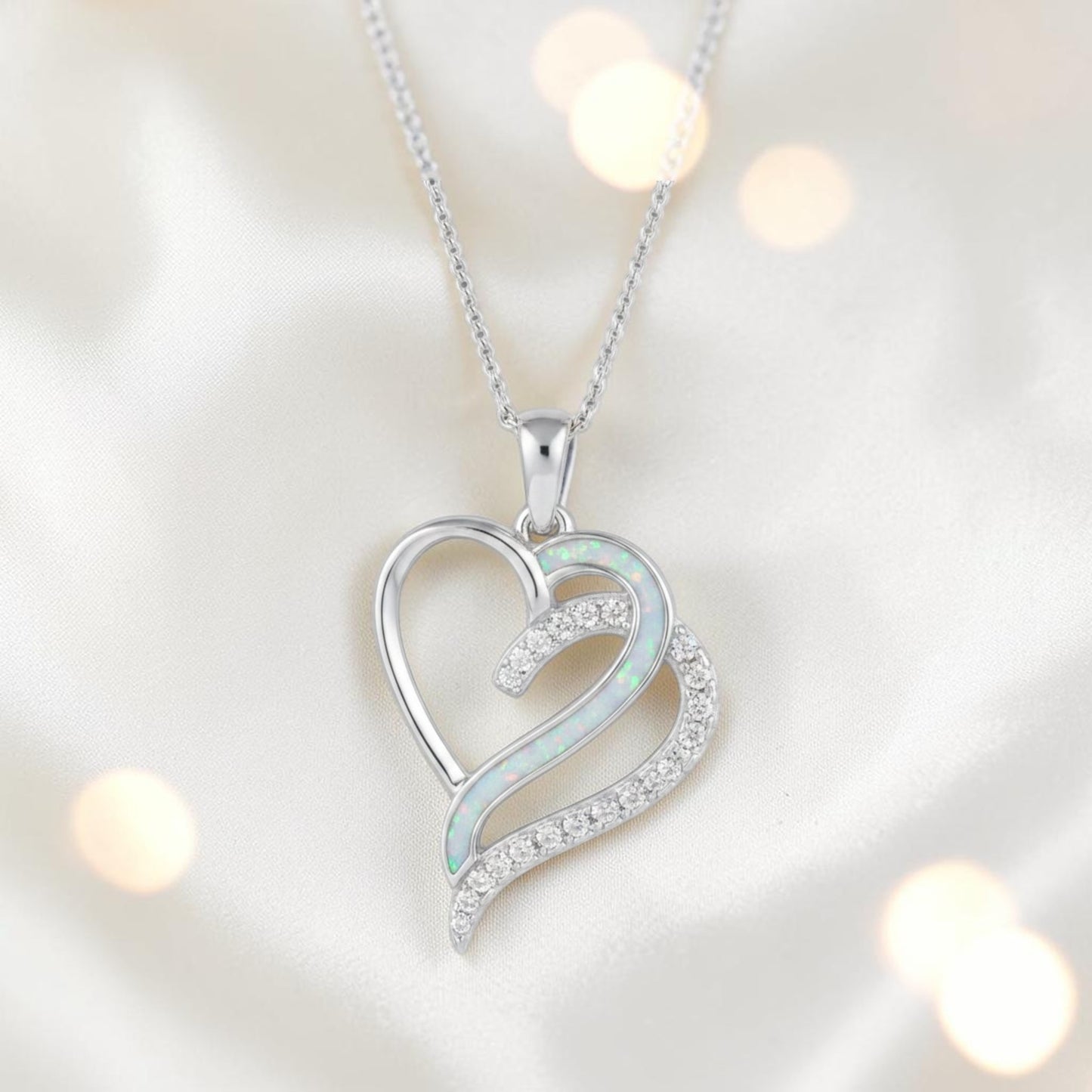 Olive Pendant — silver ashes memorial pendant with grey rainbow opal in side recess, handcrafted in Lancashire, UK