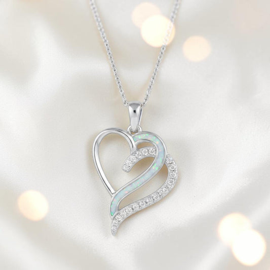 Olive Pendant — silver ashes memorial pendant with grey rainbow opal in side recess, handcrafted in Lancashire, UK