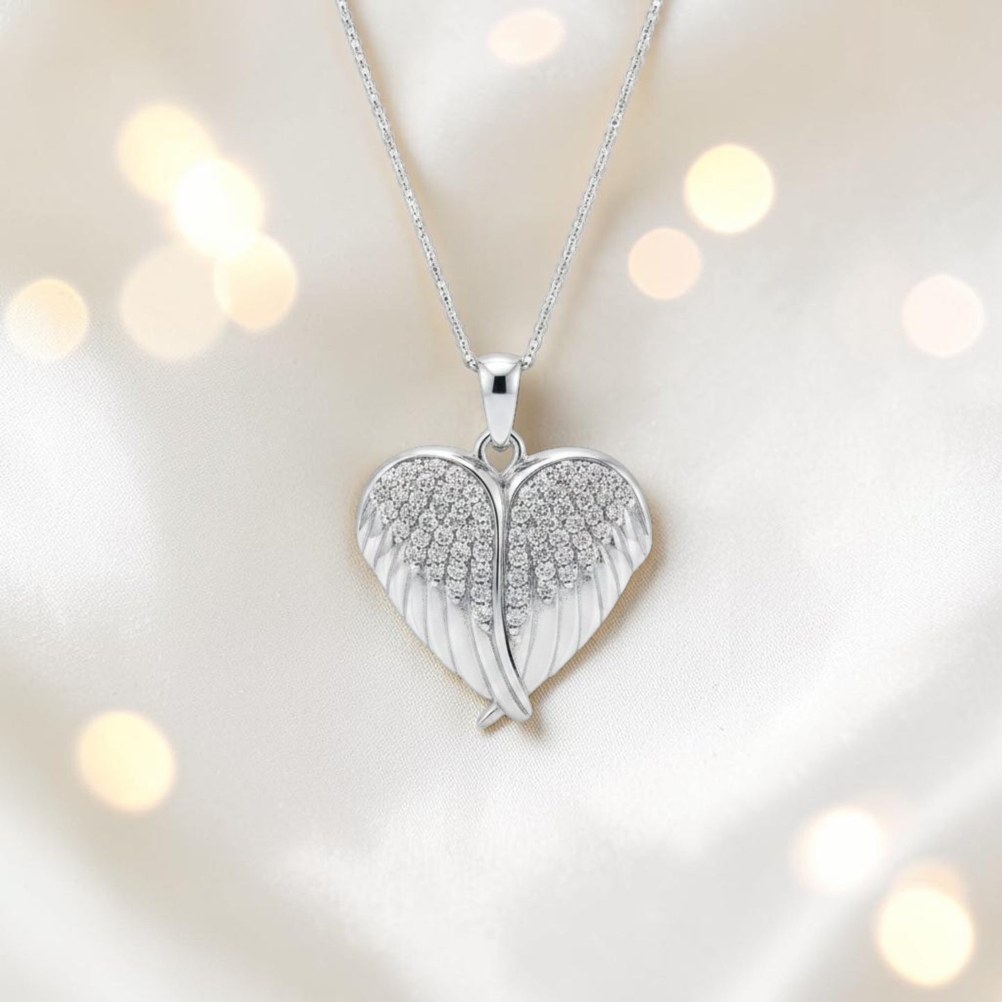 silver winged ashes heart locket, handcrafted in lancashire, uk