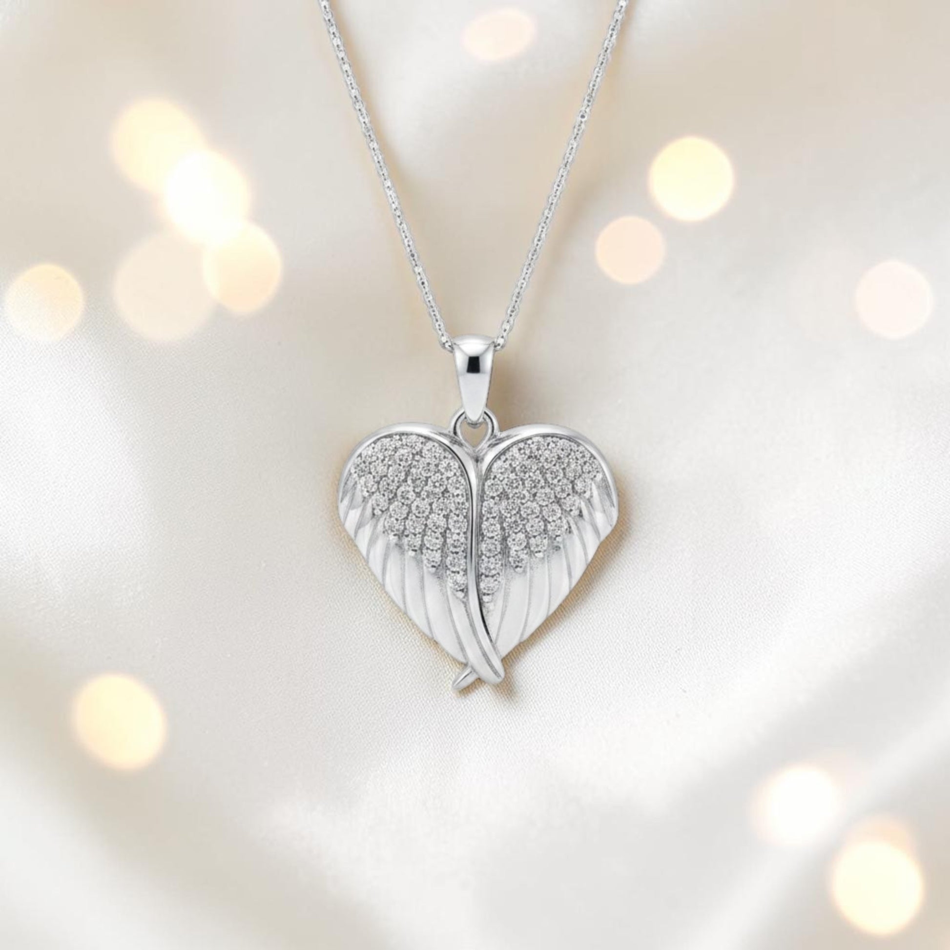 silver winged ashes heart locket, handcrafted in lancashire, uk
