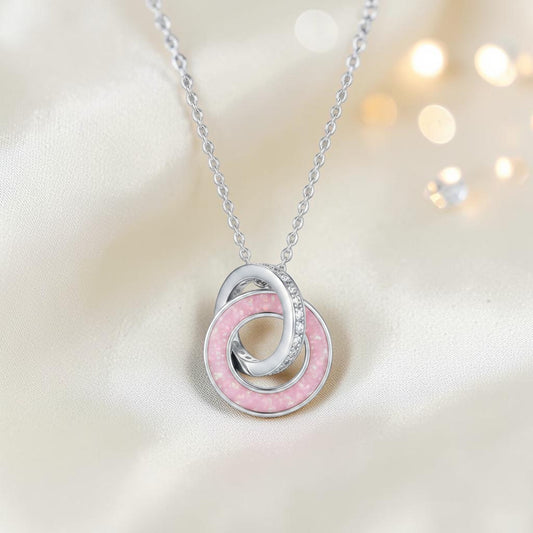 Eternal Embrace Pendant in 925 sterling silver — two interlocking rings with cubic zirconia. Handcrafted memorial jewellery, made in Lancashire Uk