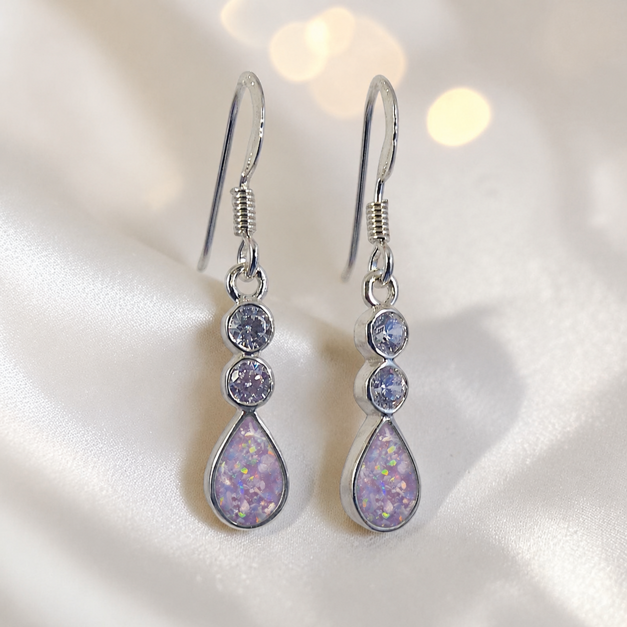 Acrux Earrings — silver pear drop ashes memorial earrings in Unicorn Purple resin, handcrafted in Lancashire, UK