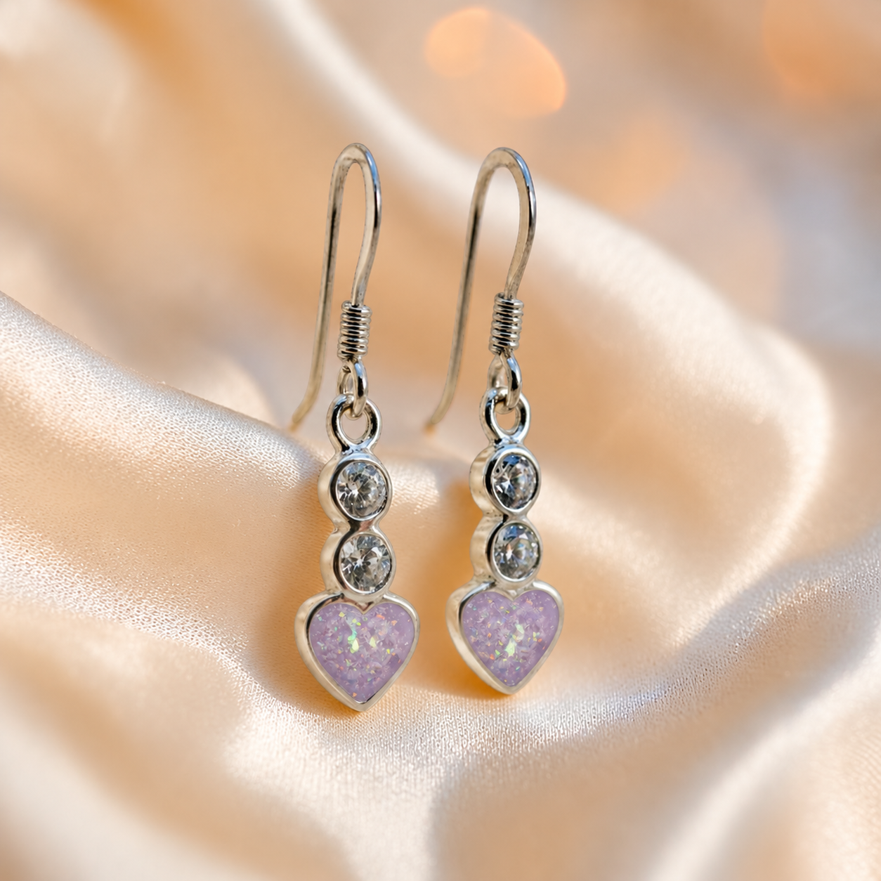 Pleione Earrings — silver heart drop ashes memorial earrings in Unicorn Purple resin, handcrafted in Lancashire, UK
