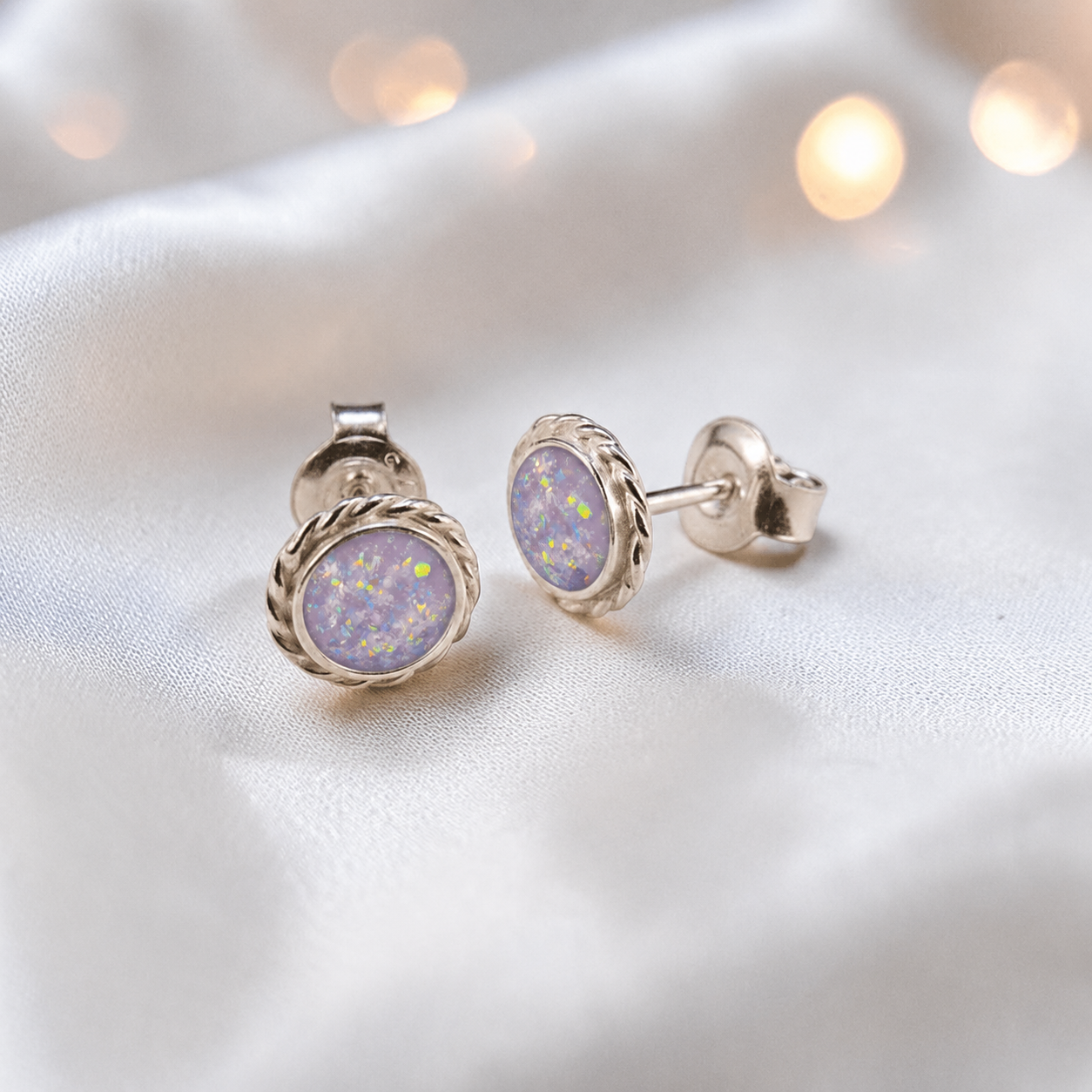 Eterna memorial stud earrings in Unicorn Purple opal — sterling silver rope edge, handcrafted in Lancashire, UK