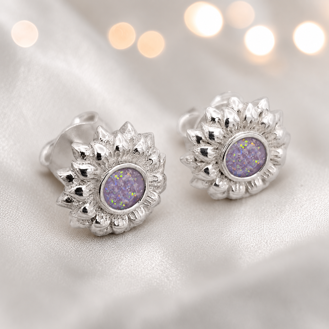 Flora Earrings — silver sunflower ashes memorial stud earrings in Unicorn Purple resin, handcrafted in Lancashire, UK