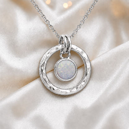 White snow hammered hollow circle sterling silver memorial pendant, handcrafted in Lancashire UK by Keepsake Memorial Jewellery
