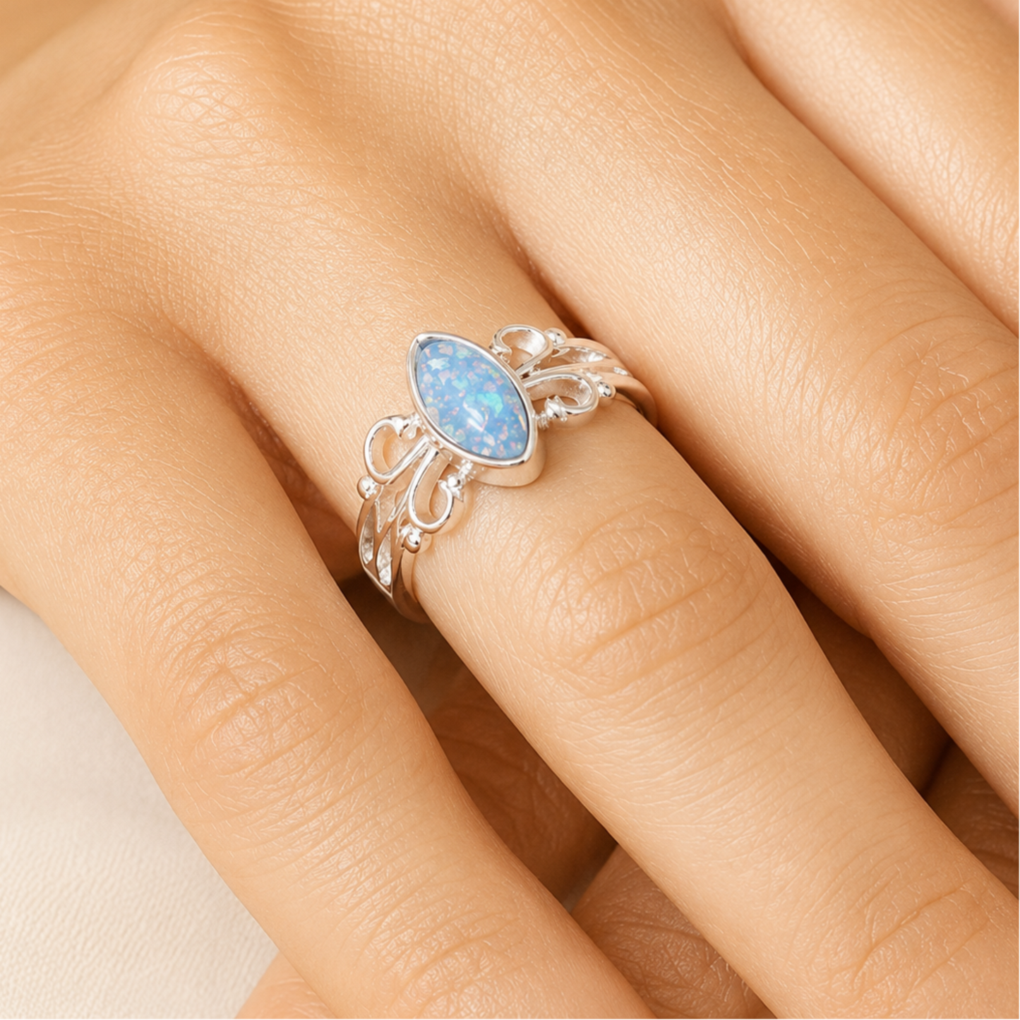 willow keepsake memorial ring in baby blue on hand, handcrafted in lancashire