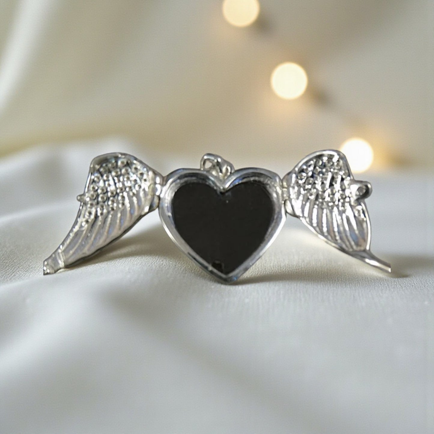 winged ashes heart locket, handcrafted in lancashire, uk