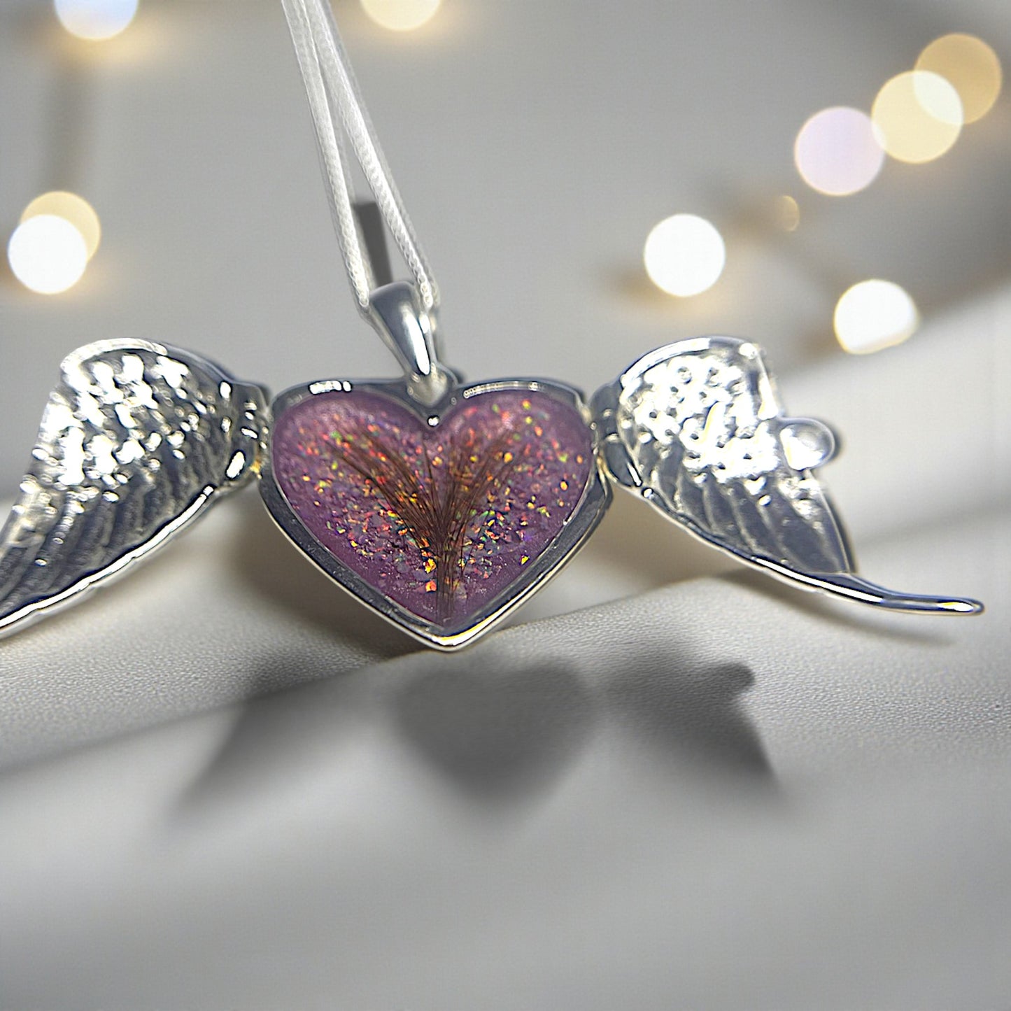 silver winged heart memorial locket, handcrafted in lancashire