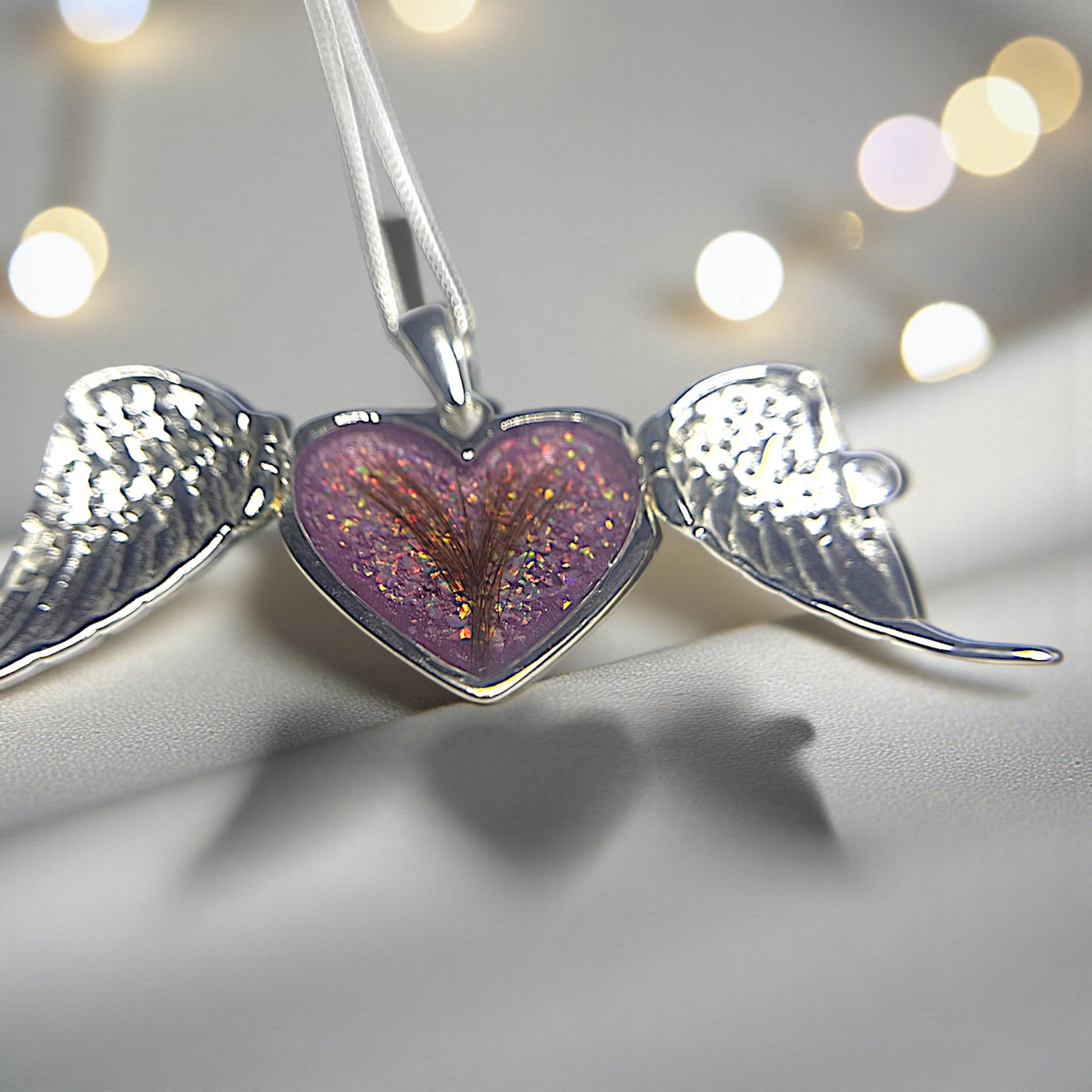 silver winged heart memorial locket, handcrafted in lancashire