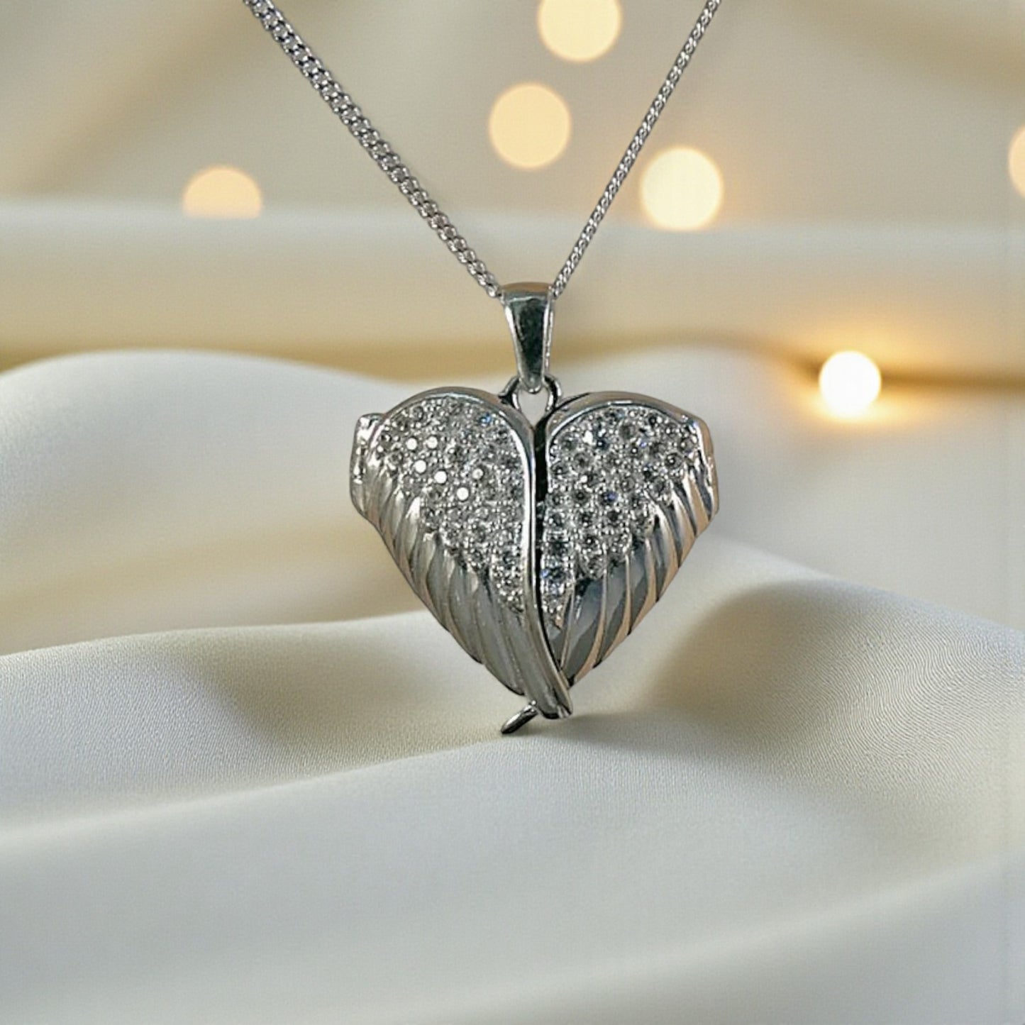 silver winged ashes heart locket, handcrafted in lancashire, uk