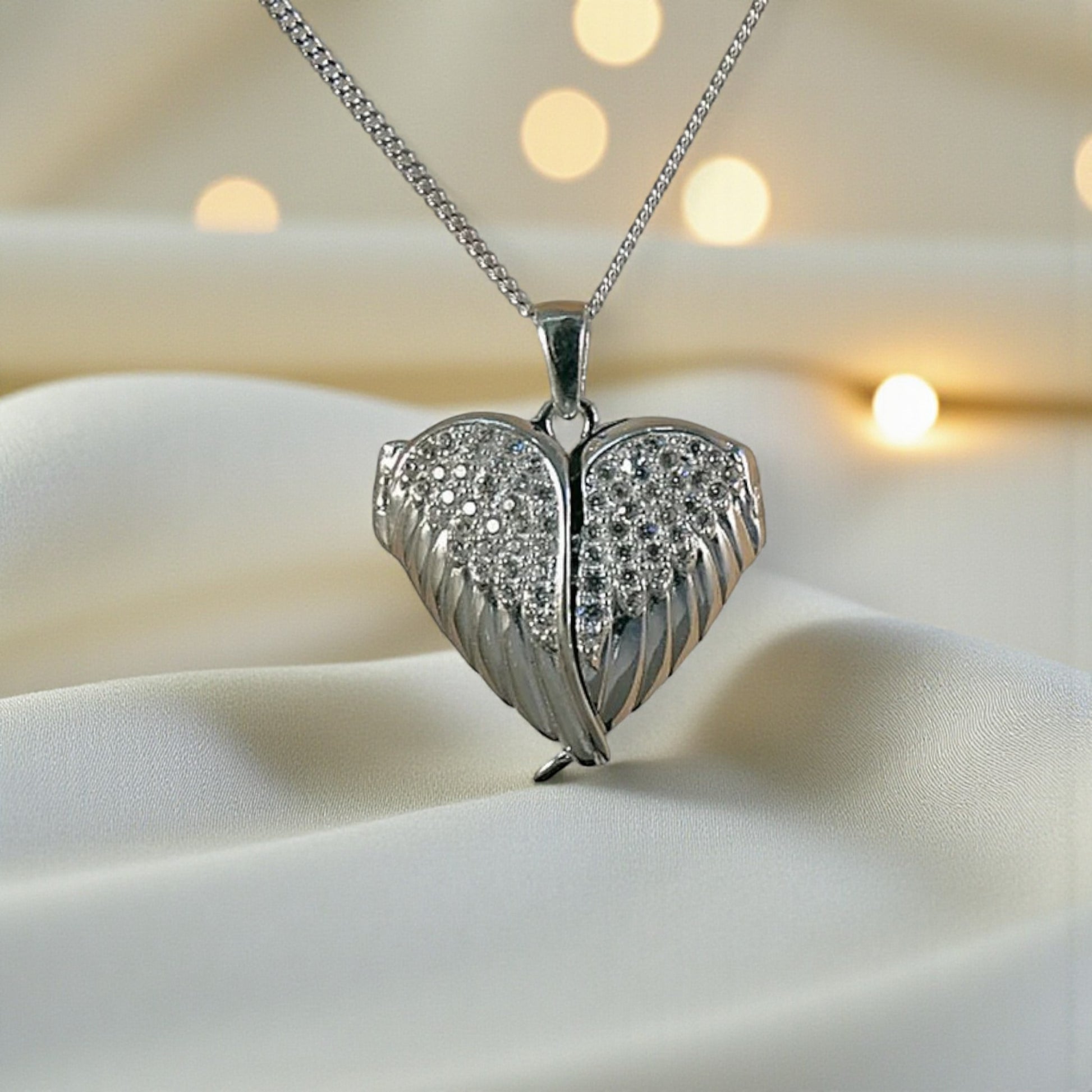silver winged ashes heart locket, handcrafted in lancashire, uk