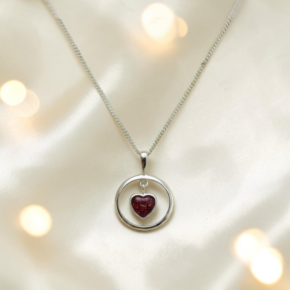 Wren silver open circle with heart drop ashes pendant, handcrafted in Lancashire UK